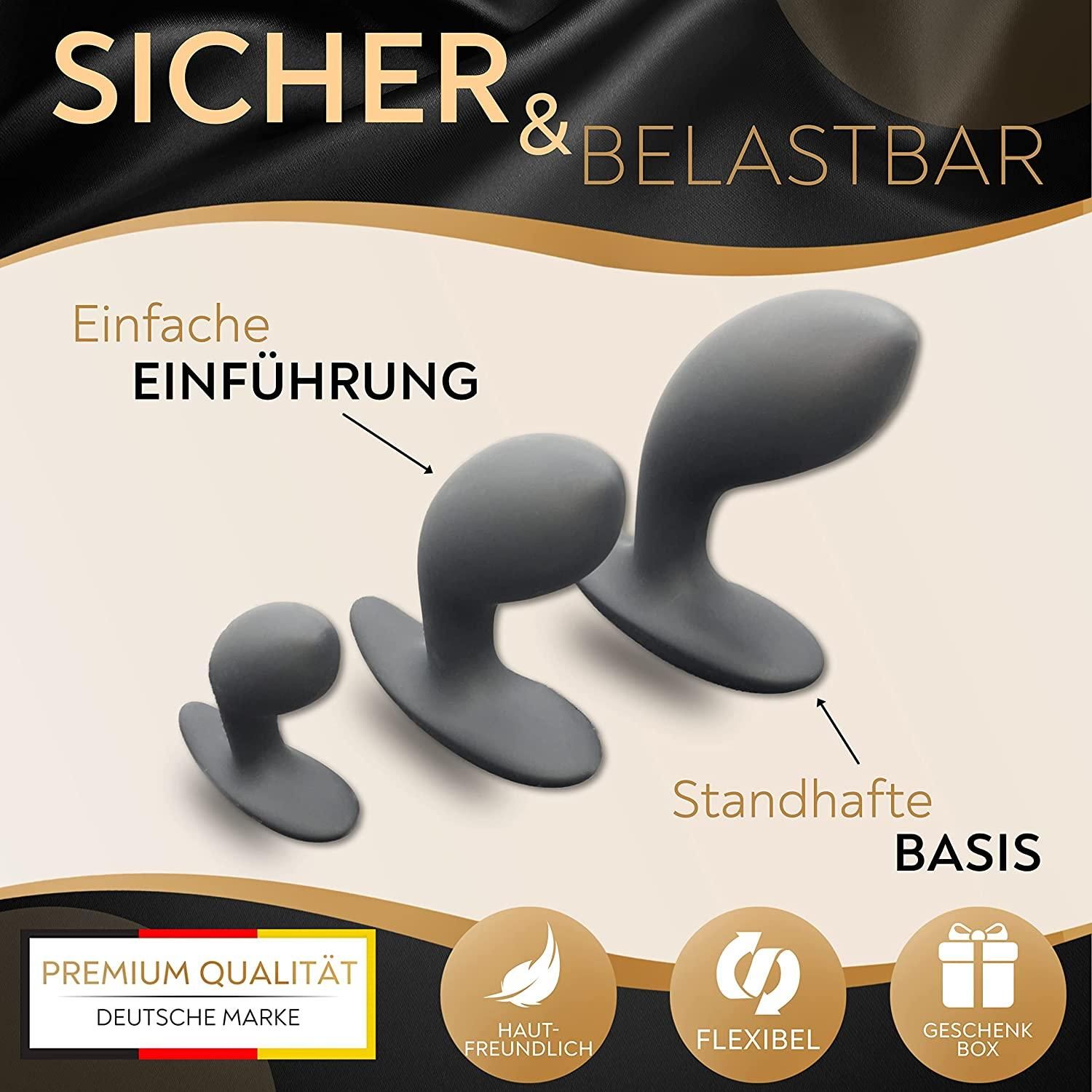 Drei graue Analplugs, verschiedene Größen, mit Text: Sicher & belastbar, einfache Einführung, standhafte Basis.