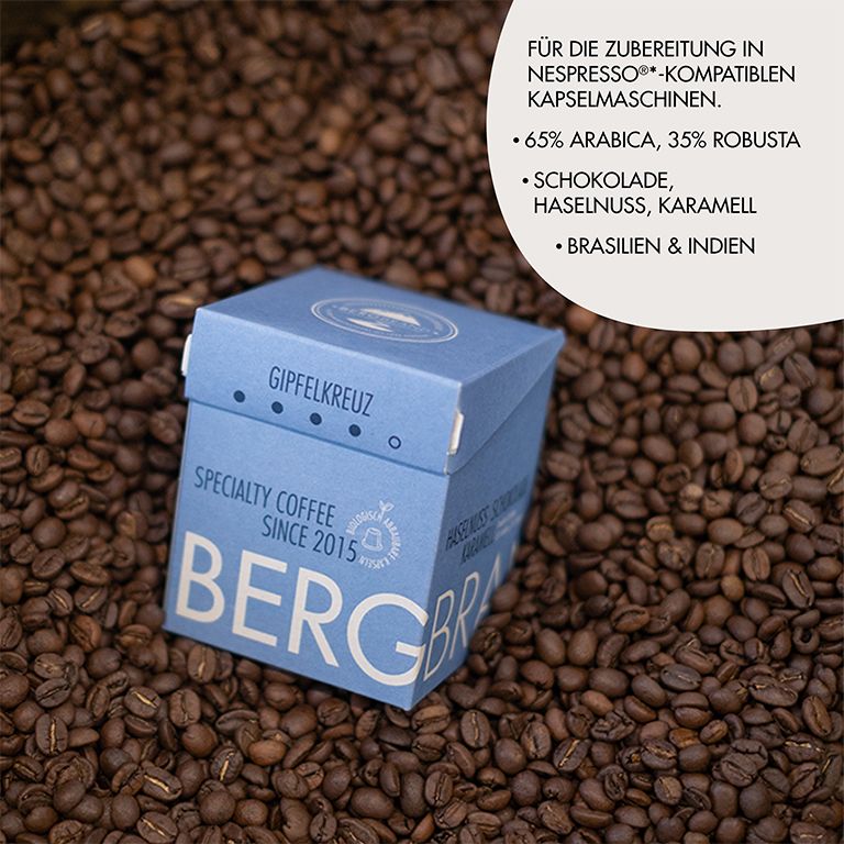 Blaue Box mit BERGBRAND-Logo auf Kaffeebohnen. Text: Für Nespresso-kompatible Kapselmaschinen.