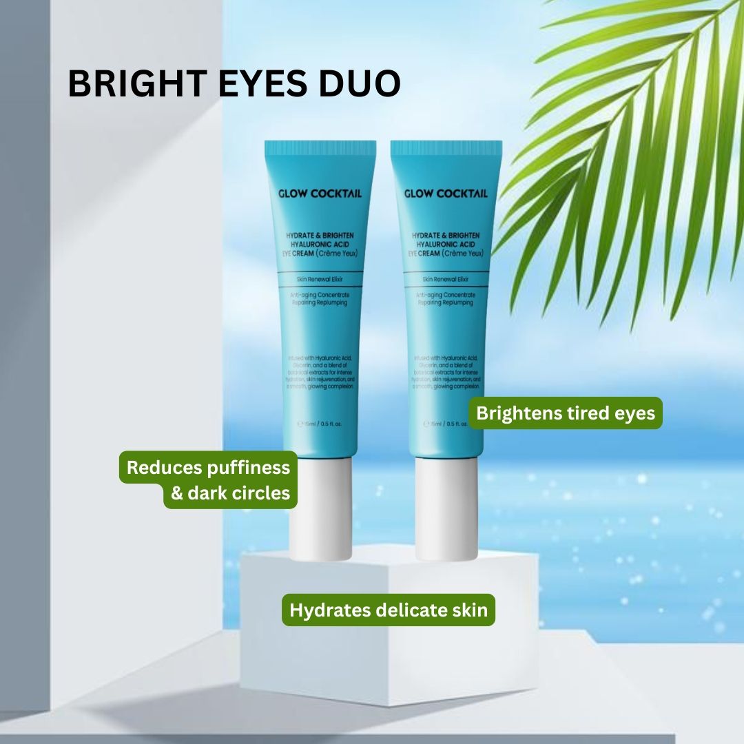 Zwei blaue Tuben mit weißem Deckel. Aufschrift: Glow Cocktail, Hydrate & Brighten Hyaluronic Acid Eye Cream. Auf weißem Podest.