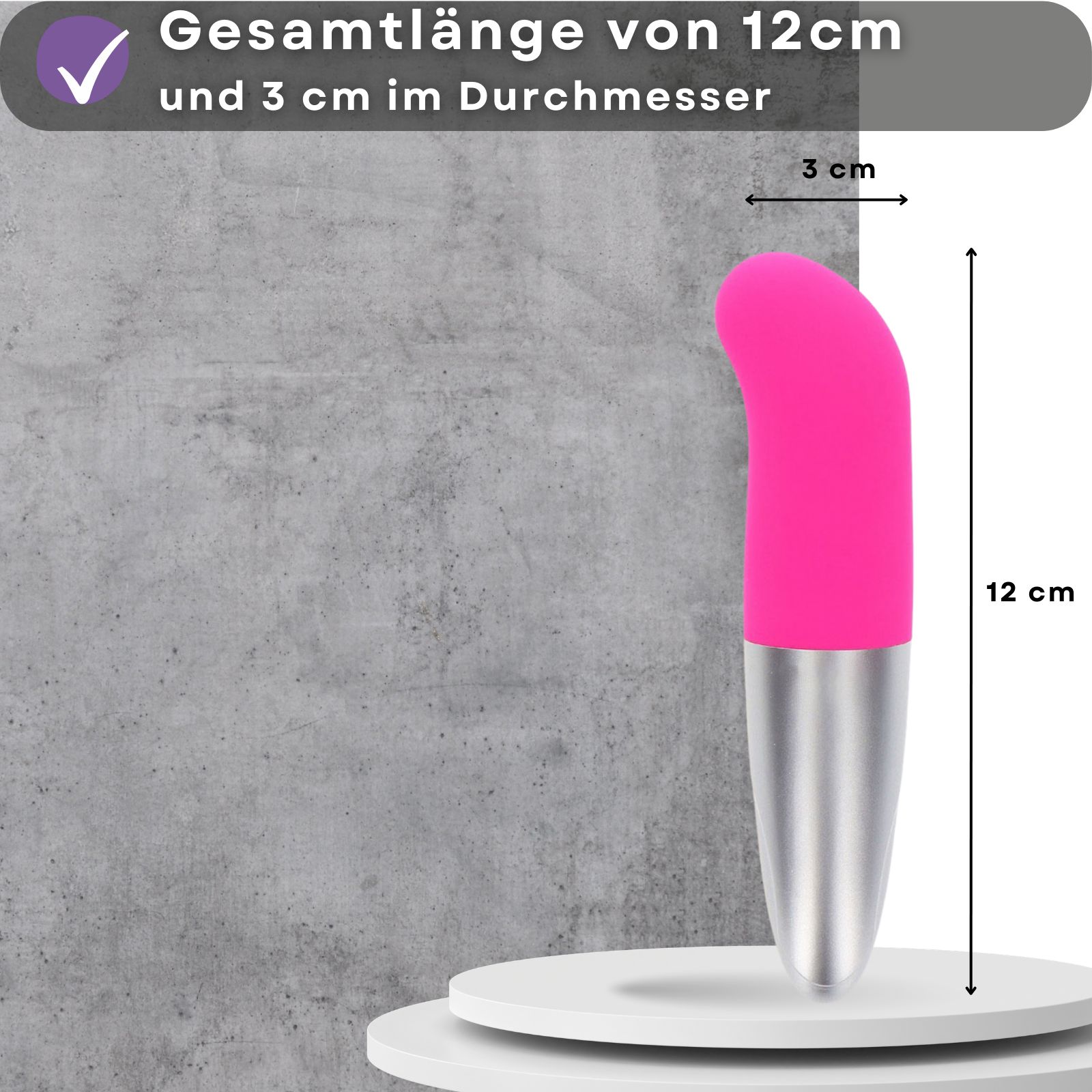 Pinkfarbener Vibrator mit silberfarbenem Schaft. 12 cm lang, 3 cm Durchmesser.