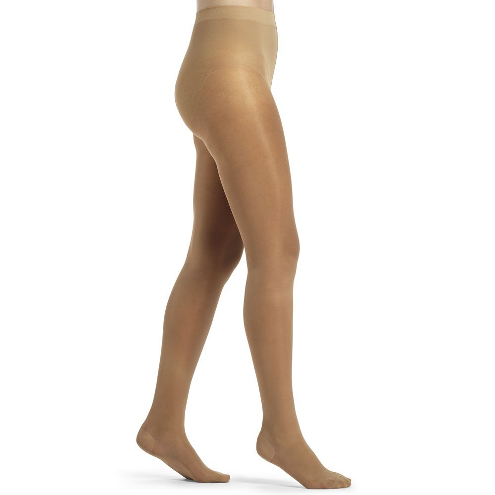 Hautfarbene Kompressionsstrumpfhose. Blick von der Seite, die Beine sind zu sehen.