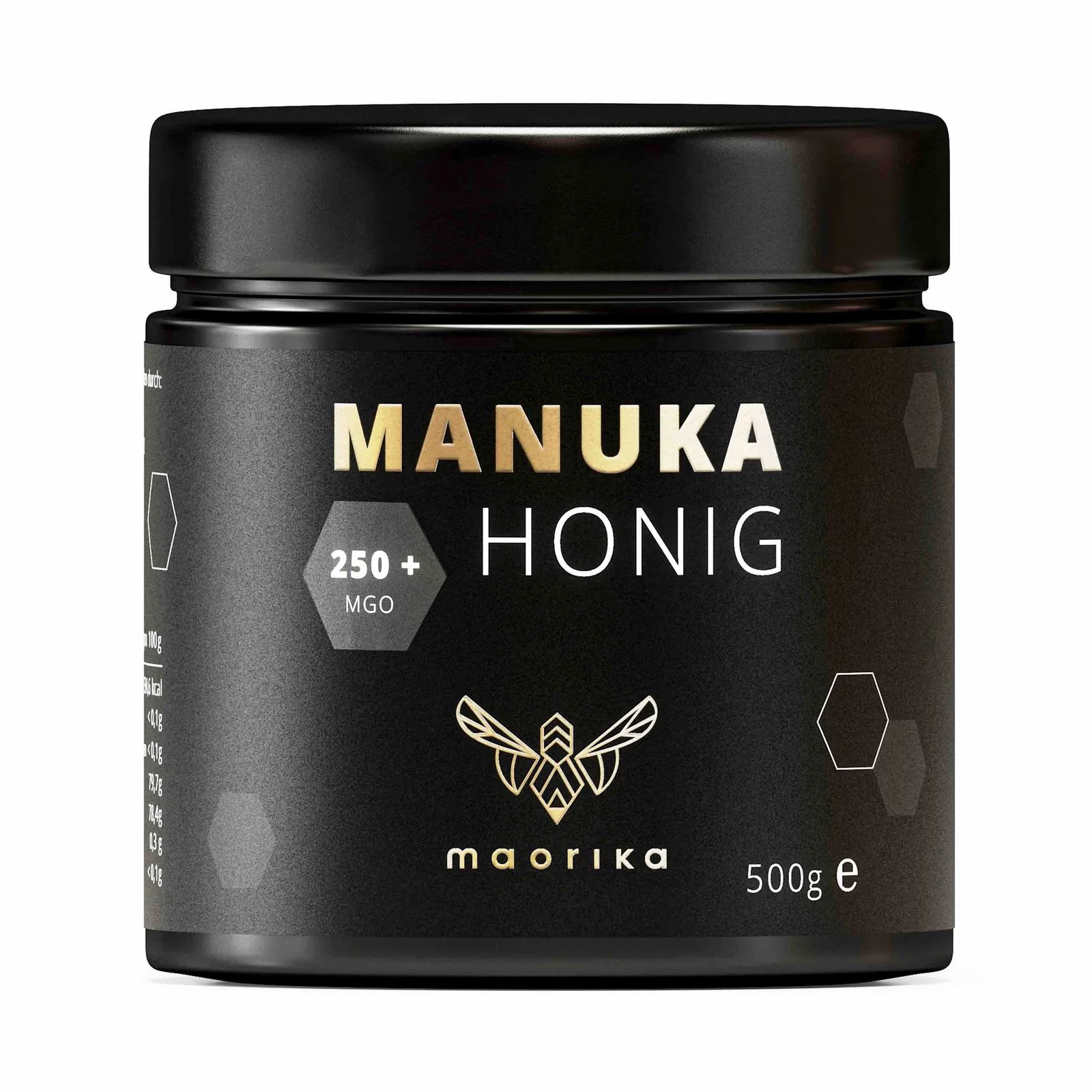 Schwarzes Glas mit "MANUKA HONIG 250+ MGO"-Etikett. Marke: maorika. 500g e.