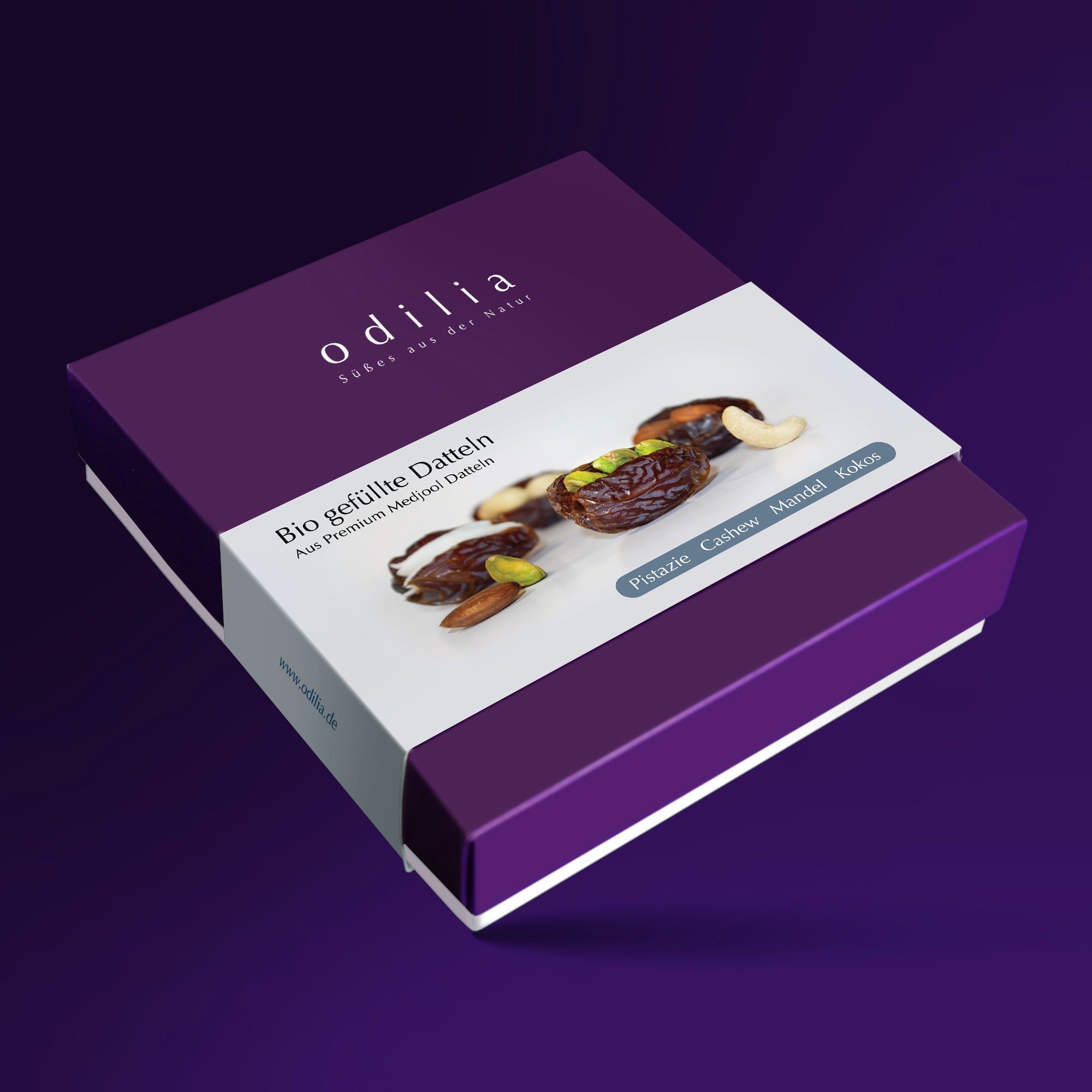Lila Geschenkbox mit Odilia Bio gefüllten Datteln, gefüllt mit Pistazien, Cashew, Mandeln und Kokos.