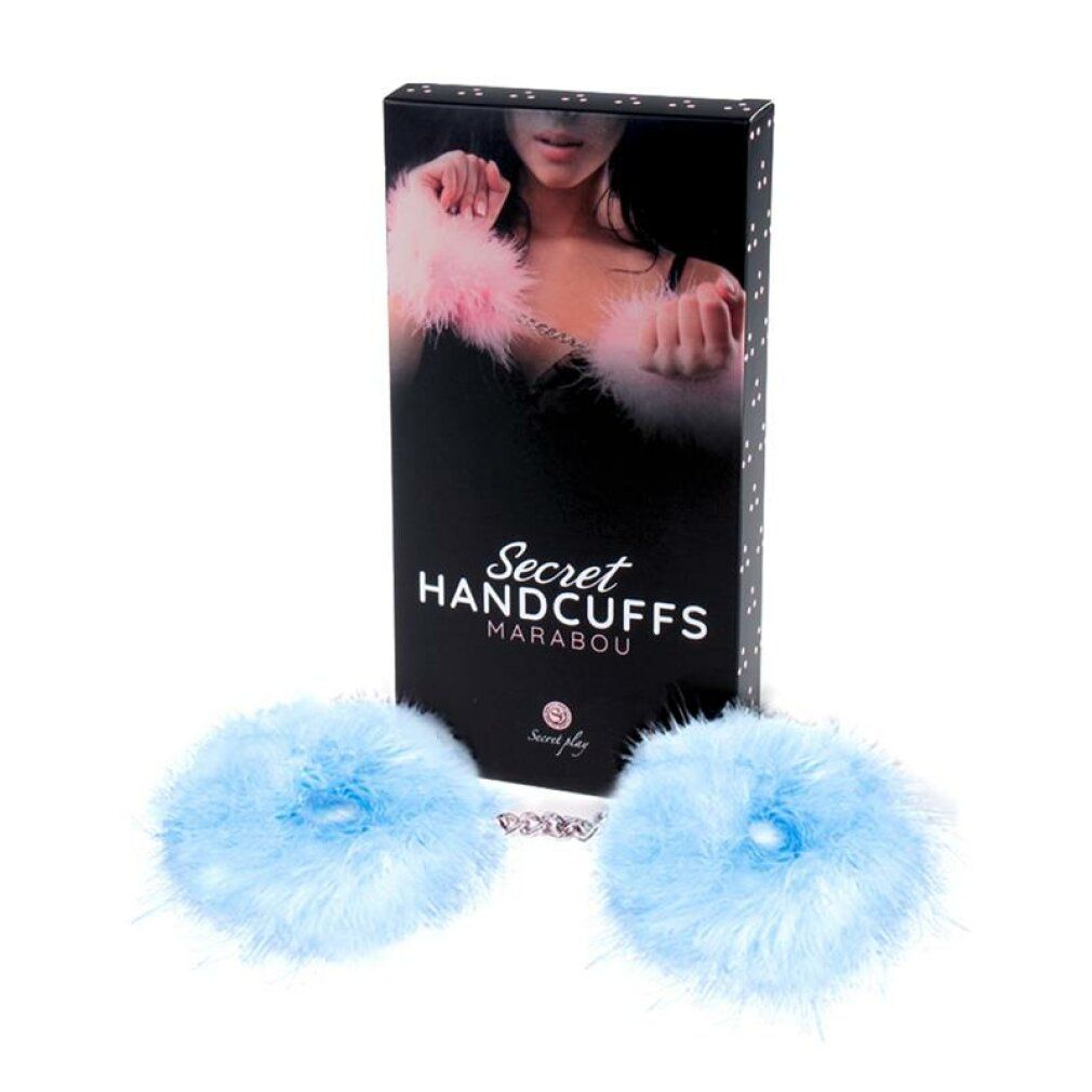 Hellblaue Handschellen mit Federn und Verpackung. Schwarze Schachtel mit Produktbild und Schriftzug.