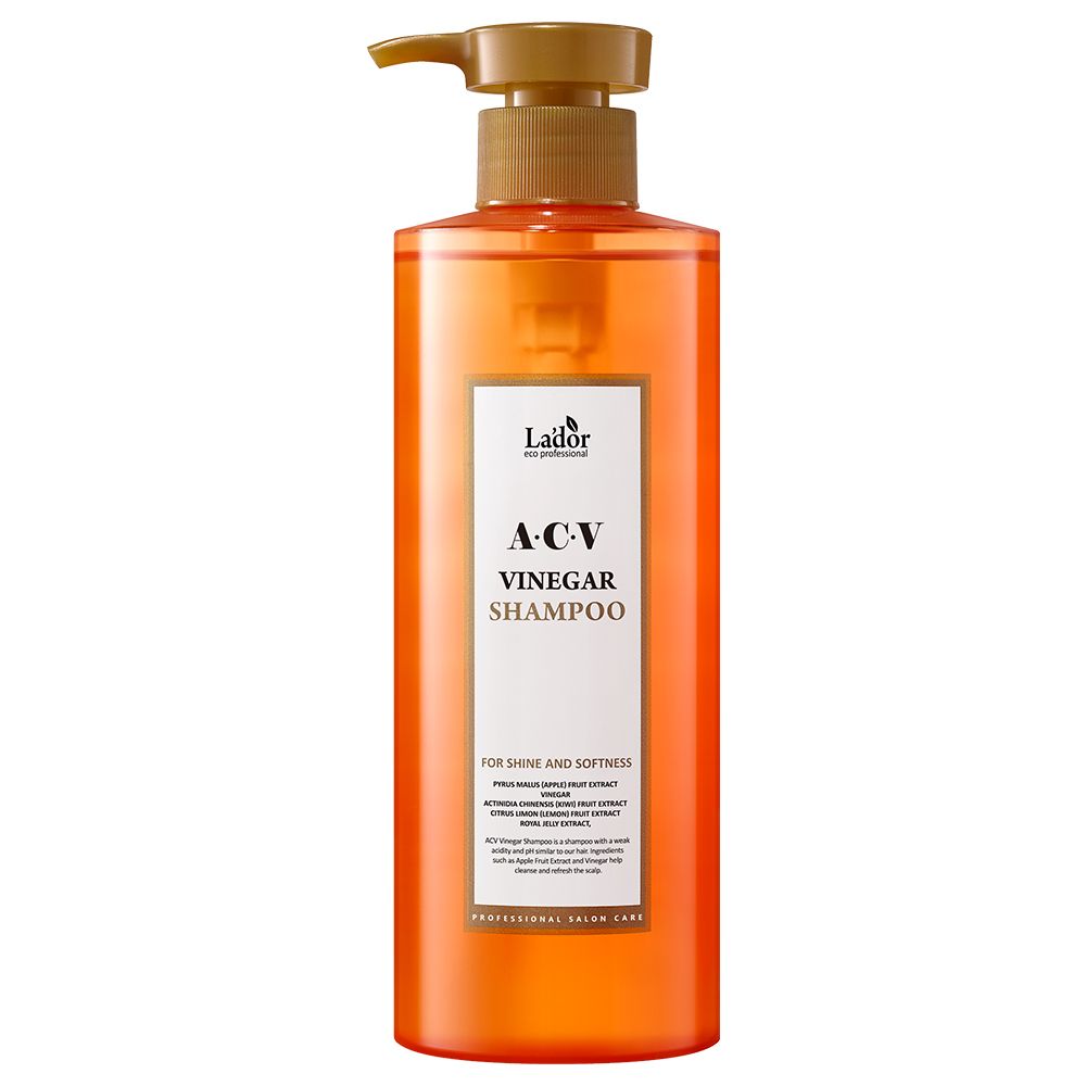 Orangefarbene Flasche mit Pumpspender, Lador A.C.V. Essig-Shampoo für Glanz und Geschmeidigkeit.