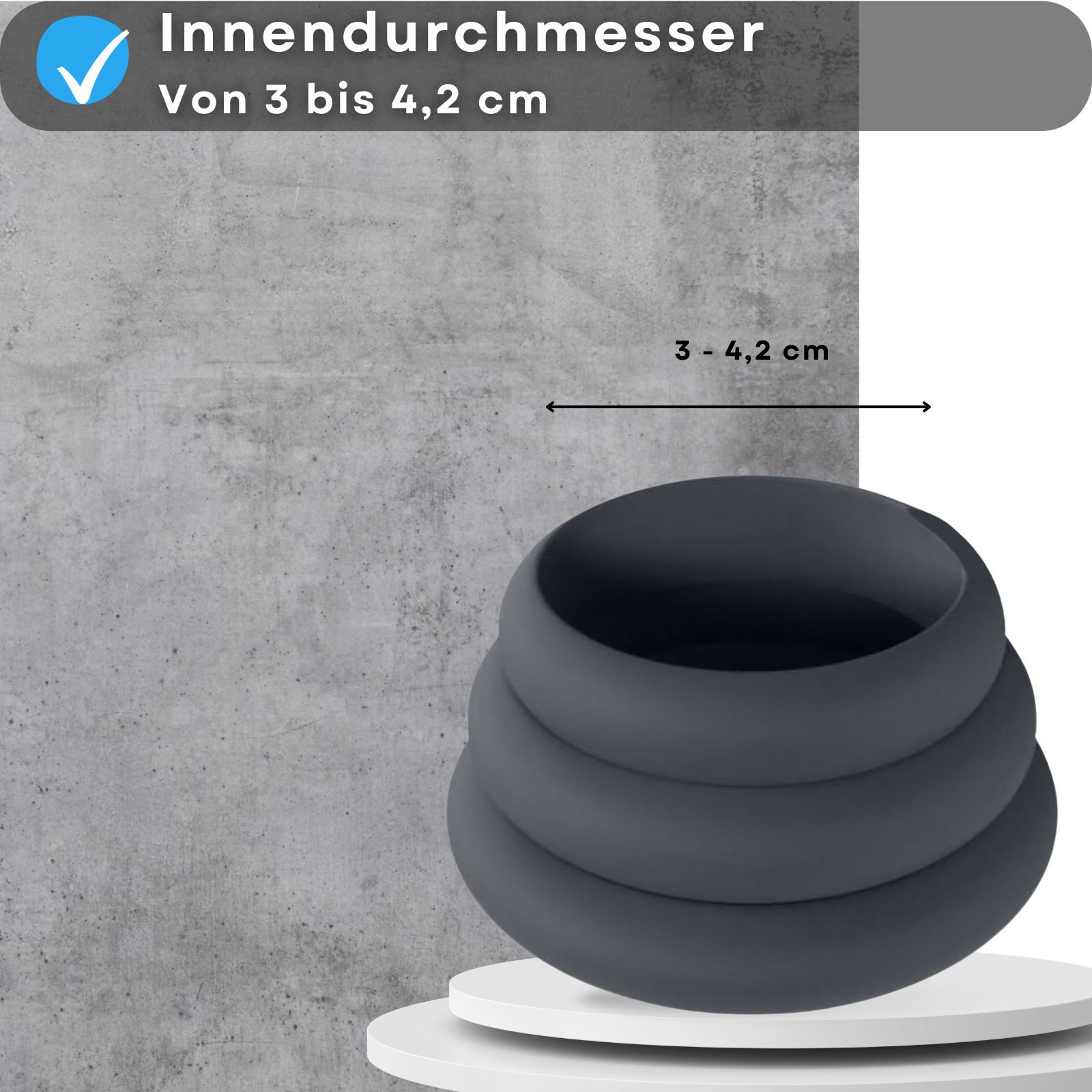 Produktabbildung mit Text: Innendurchmesser von 3 bis 4,2 cm. Graue Silikonringe auf Podest.