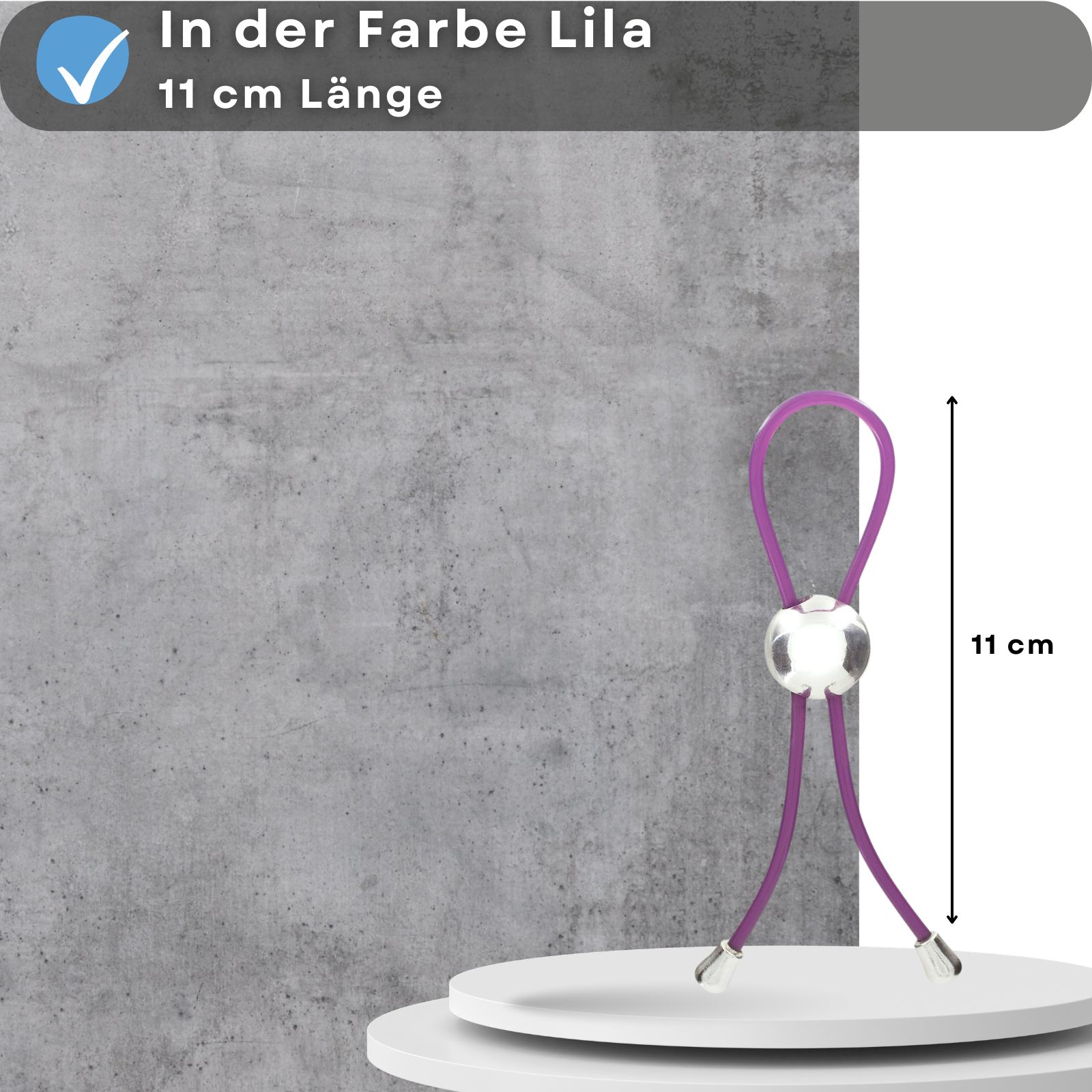 Penisschlaufe, lila, mit silberfarbenem Element. Text: lila, 11 cm Länge. Maßangabe: 11 cm.