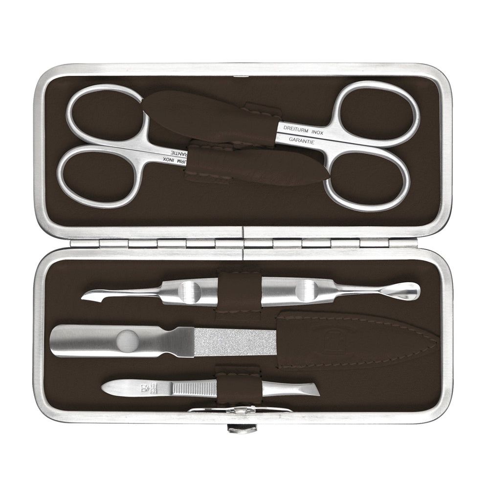 Maniküre-Etui, Metallrahmen, braunes Leder. Enthält Nagelschere, Feile und Werkzeuge. Innenfutter braun.
