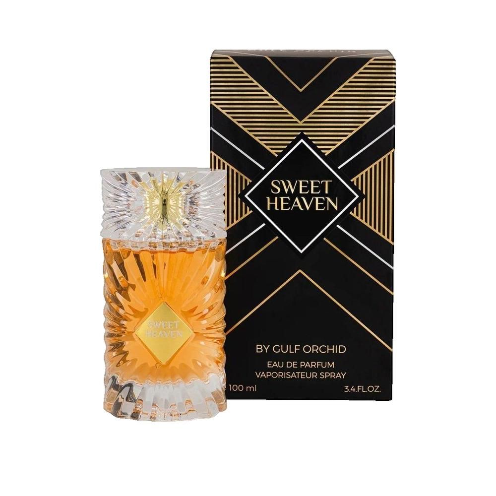 Parfumflakon und Schachtel. Flakon mit goldfarbener Flüssigkeit, goldfarbenem Etikett. Schwarze Schachtel mit goldenen geometrischen Mustern und Text.