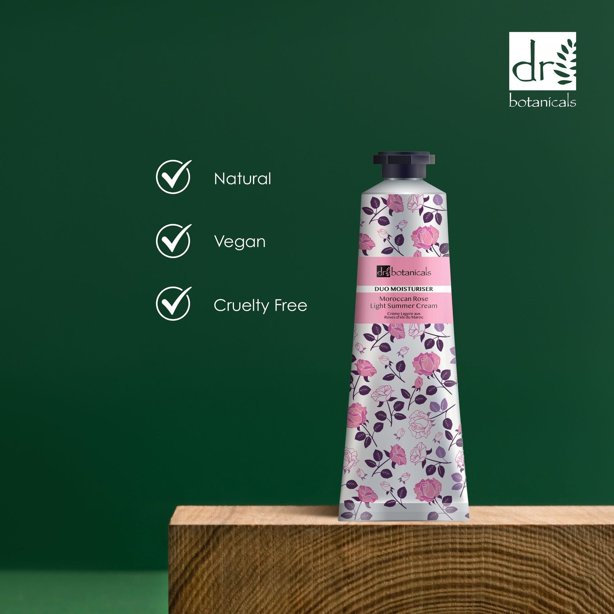Tube mit floralem Muster auf Holzblock. Text: Natural, Vegan, Cruelty Free. Logo: Dr Botanicals.