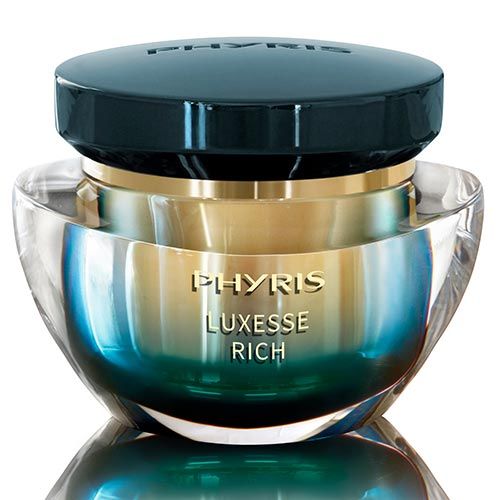Creme-Glasbehälter mit schwarzem Deckel. Aufschrift PHYRIS LUXESSE RICH in Gold. Blau-goldene Farbgebung.