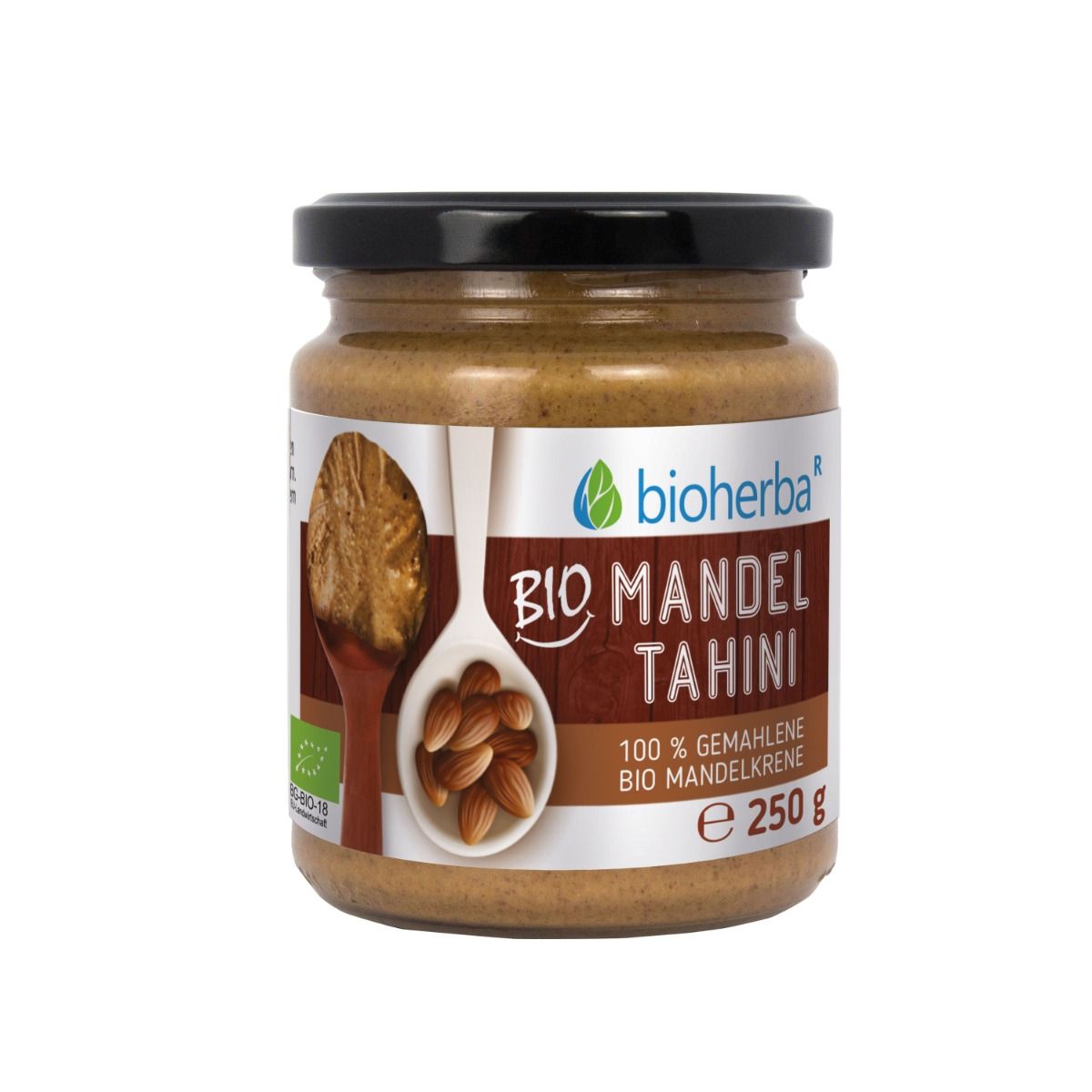 Glas mit Bioherba Bio Mandel Tahini. Schwarzer Deckel, Etikett mit Produktinformationen und Bio-Siegel. 250g.