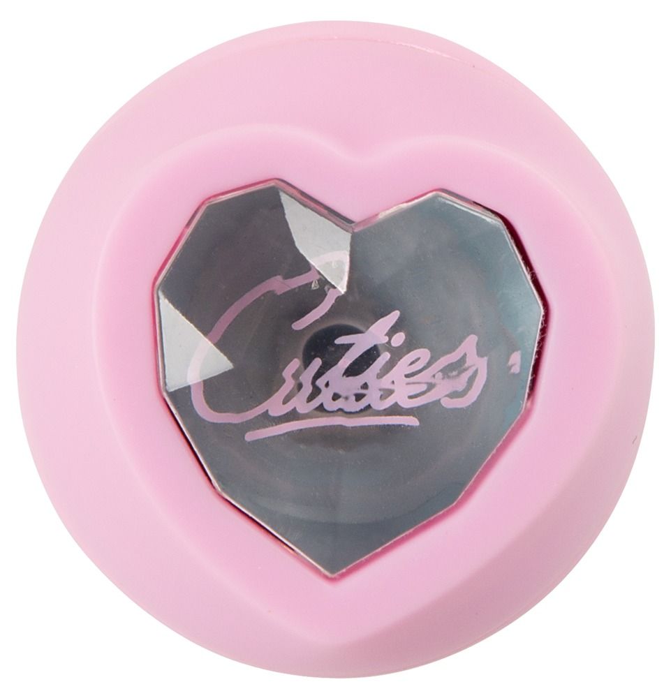 Oberseite eines rosa Mini-Vibrators mit herzförmigem, facettiertem Aufsatz.