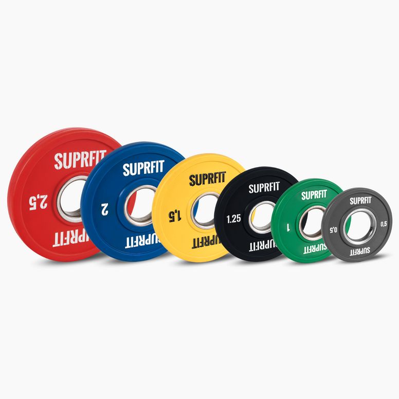 Sechs farbige Suprfit Mini Bumper Plates. Rot, blau, gelb, schwarz, grün, grau. Aufschrift SUPRFIT. Gewicht in kg.