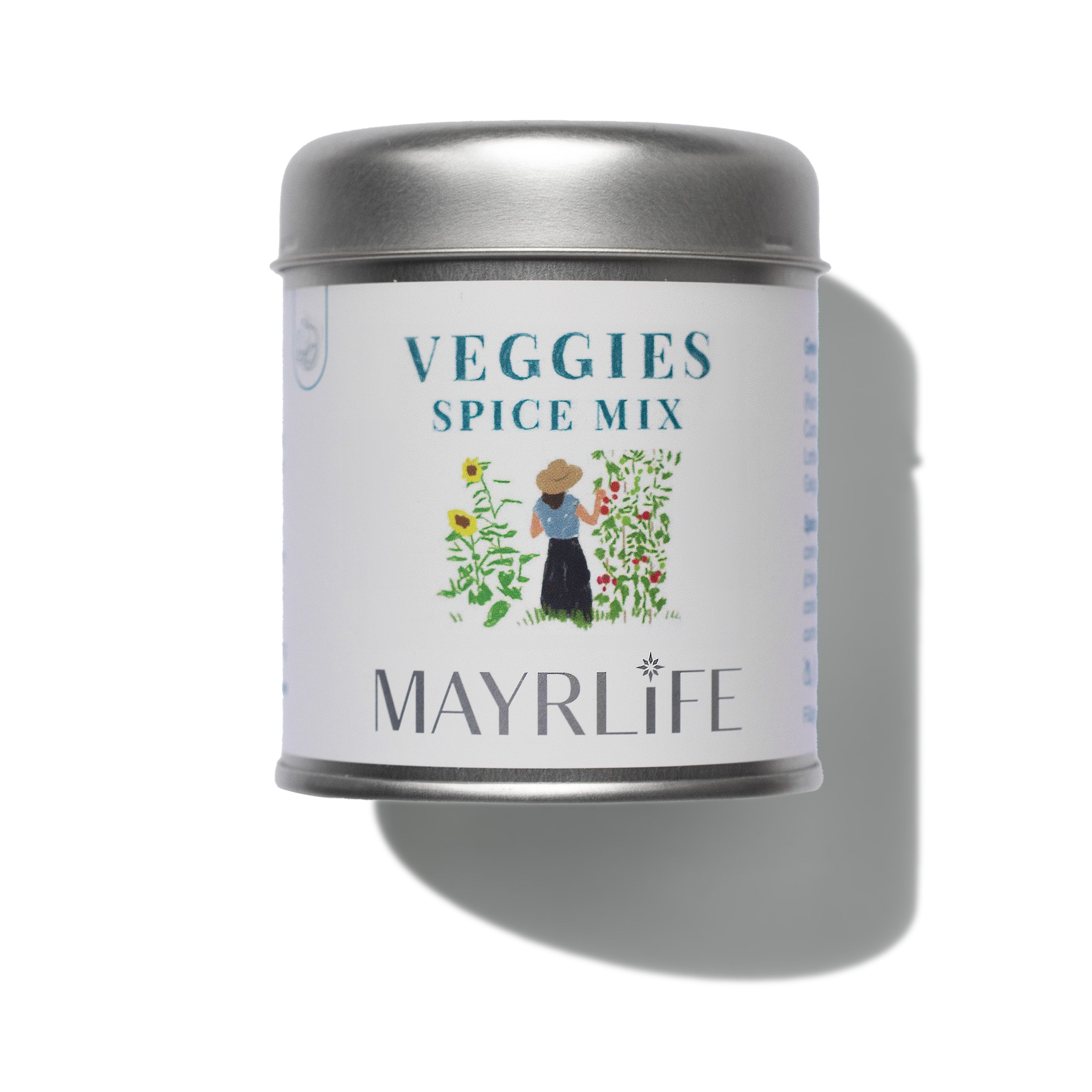 Runde Dose mit Deckel. Aufschrift "VEGGIES SPICE MIX" und MAYRLIFE. Illustration einer Person im Garten. Silberfarbener Deckel.