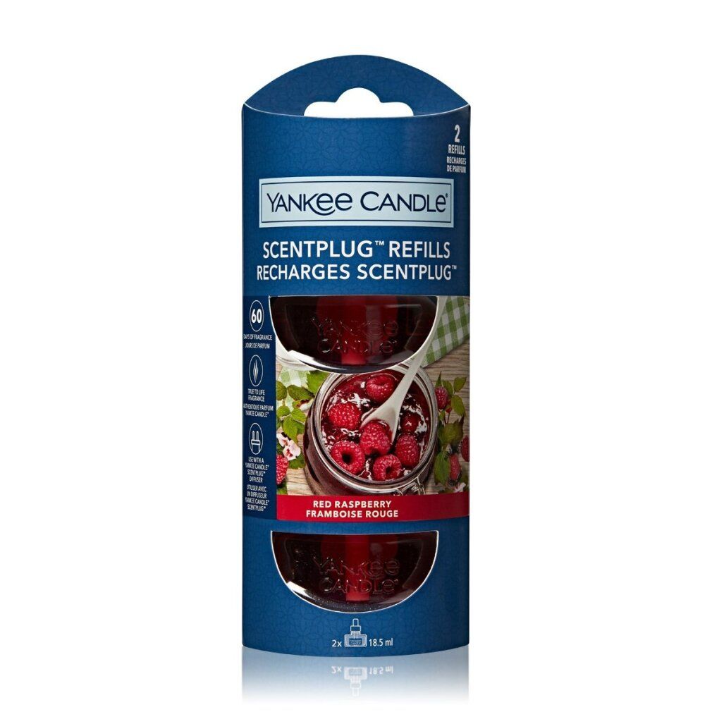 Yankee Candle Scentplug Nachfüllung, rote Himbeere. Zwei Nachfüllungen in blauer Verpackung. Produktabbildung mit Himbeeren.