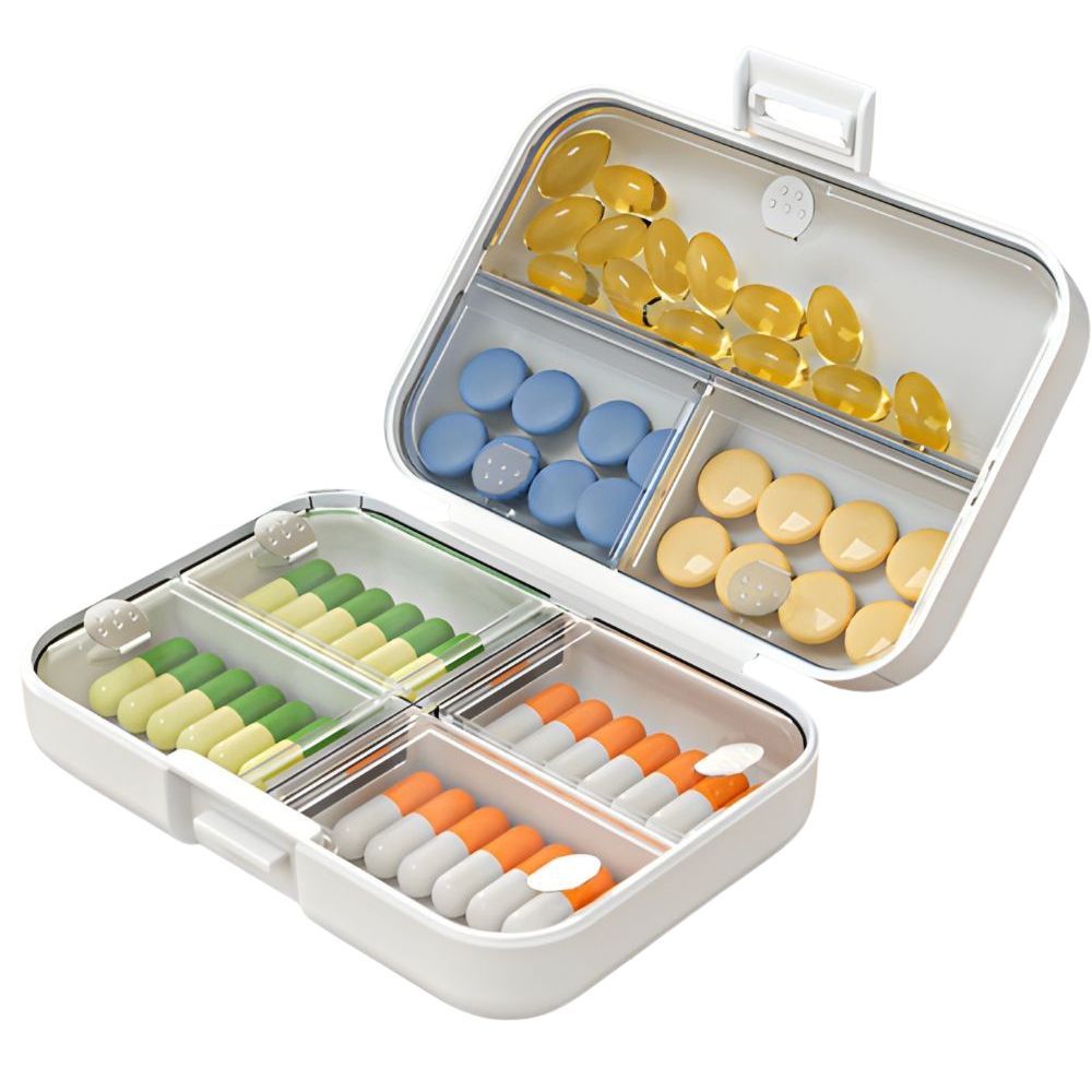 Weißer Tablettenbox mit transparenten Fächern, gefüllt mit Pillen in verschiedenen Farben. Offen, mit geöffnetem Deckel.