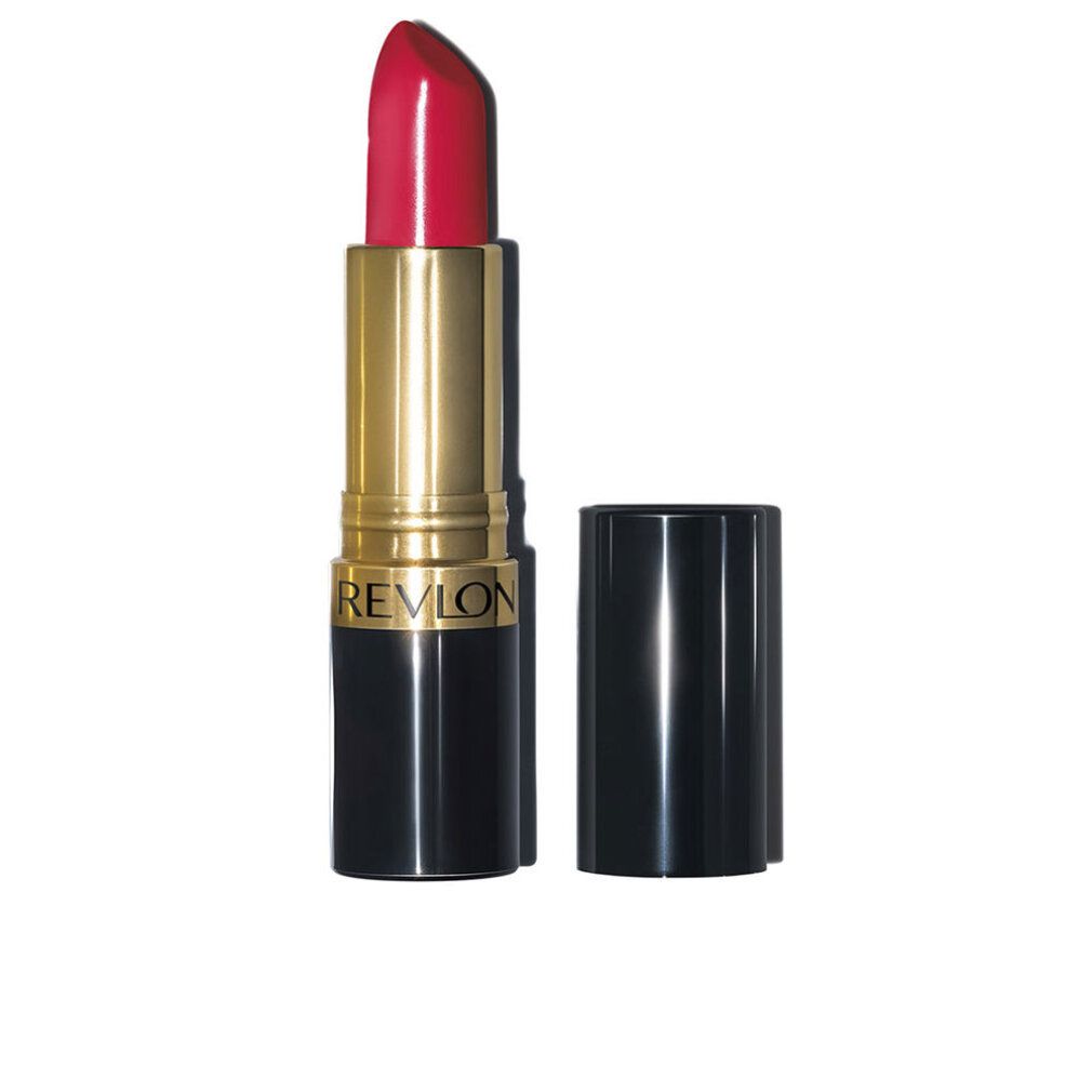 Lippenstift mit roter Spitze, goldener Hülse und schwarzem Boden. Deckel daneben. Marke: Revlon.