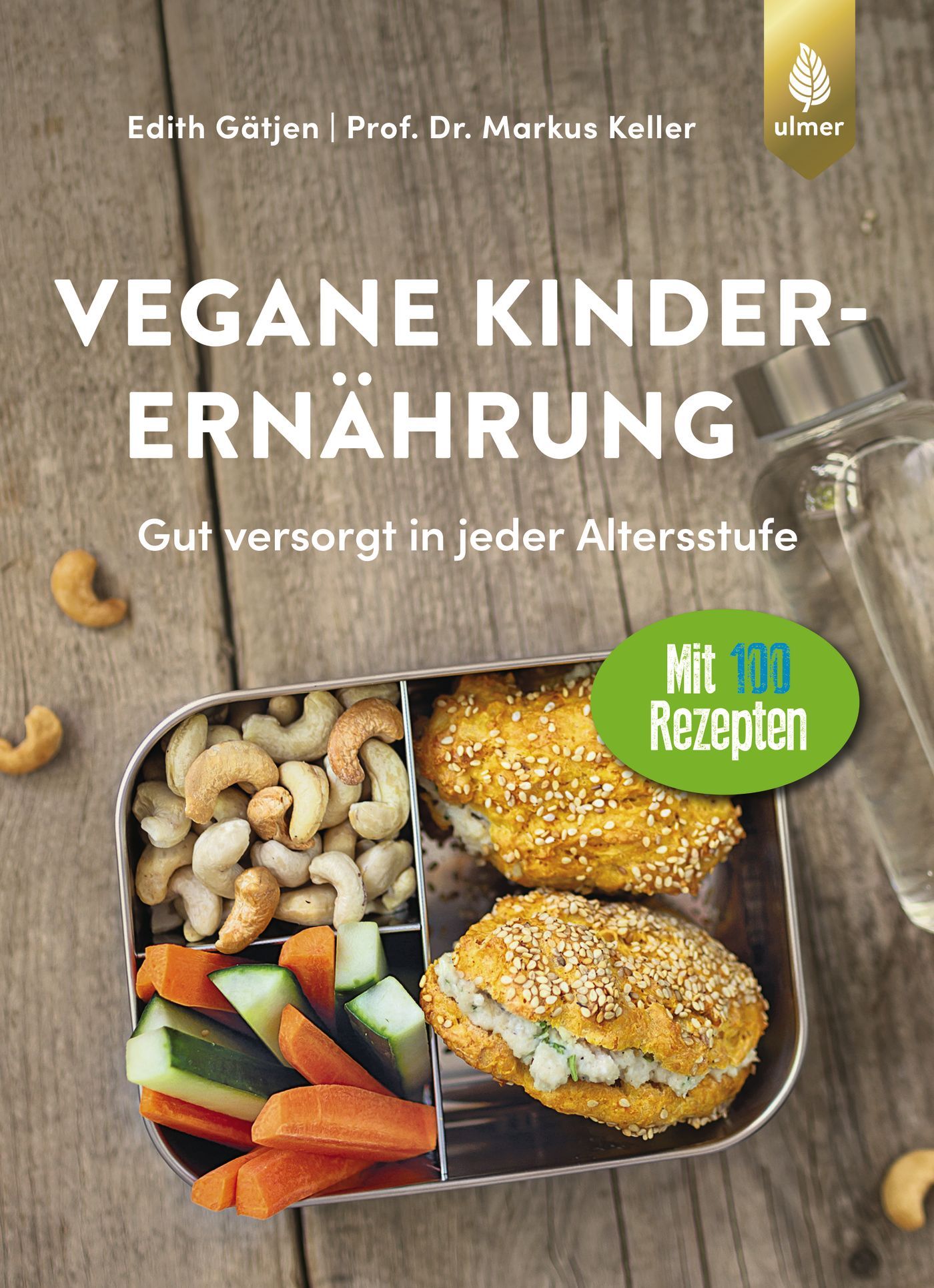 Buchcover: Vegane Kinderernährung. Titel, Autoren, Logo Ulmer. Lunchbox mit Cashewnüssen, Gemüse, Brötchen. Grünes Label: 100 Rezepte.