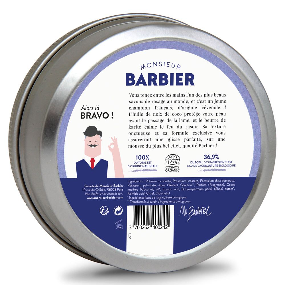 Rasierschaum in Dose. Metallbehälter mit blauem Deckel. Text: "Monsieur BARBIER", Bio-Zertifizierung, Inhaltsstoffe. Mann-Illustration.