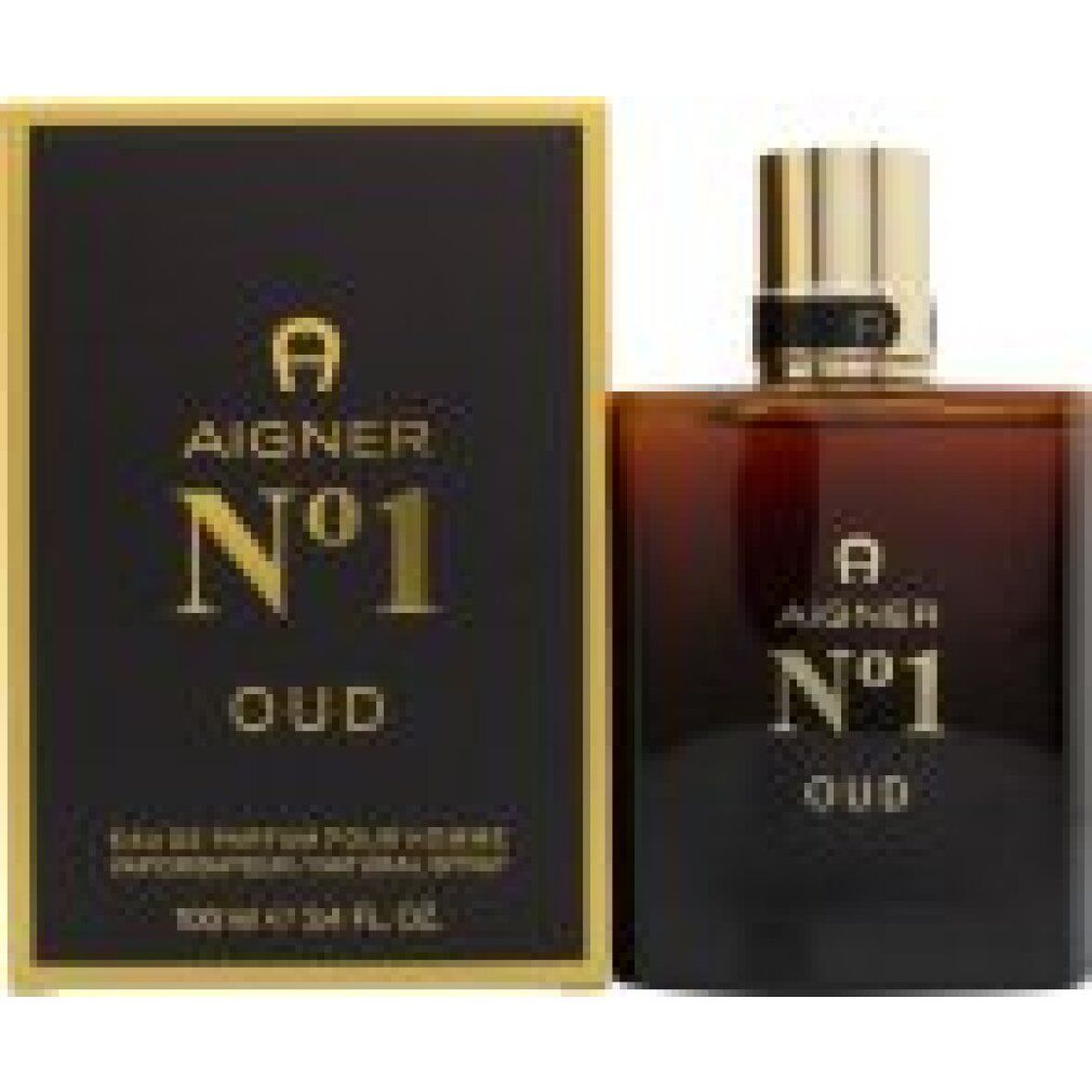 Parfümflakon und Verpackung. Flakon aus Glas mit goldfarbenem Verschluss. Schwarze Verpackung mit goldfarbenem Schriftzug.