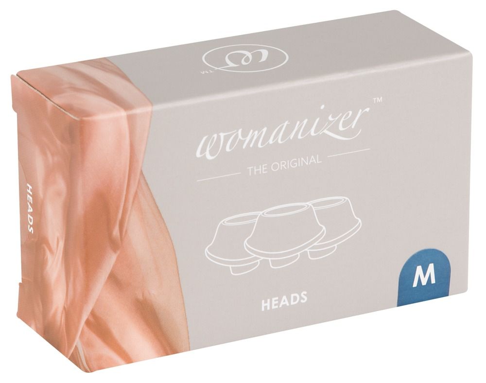 Verpackung mit dem Logo und Schriftzug 'Womanizer'. Auf der Verpackung sind drei schematische Darstellungen von Aufsätzen abgebildet.