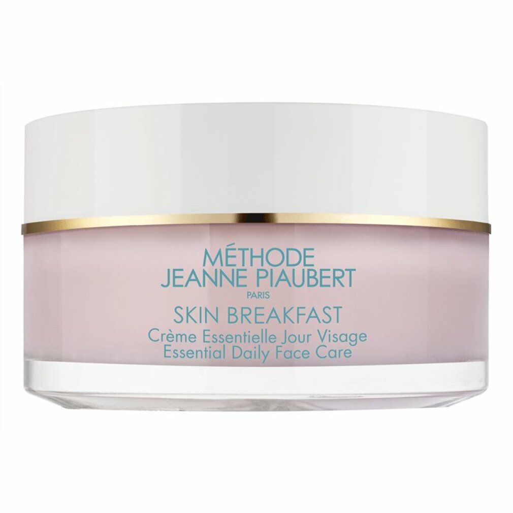 Creme-Tiegel mit weißem Deckel und rosa Inhalt. Goldener Ring. Schriftzug SKIN BREAKFAST.
