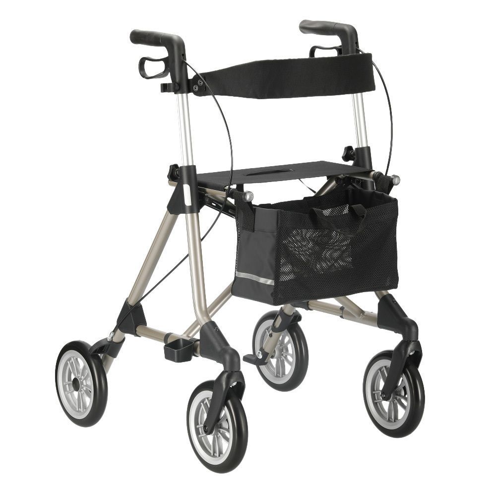 Rollator mit champagnerfarbenem Rahmen, schwarzem Sitz und Korb. Vier Räder, Handgriffe und Bremsen.
