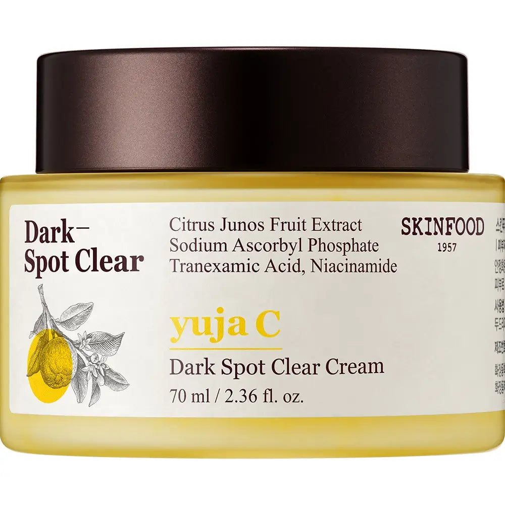 Cremetiegel mit gelber Creme und braunem Deckel. Aufschrift: Dark Spot Clear, Yuja C, SKINFOOD. Produktinformationen und Inhaltsstoffe sind ebenfalls sichtbar.