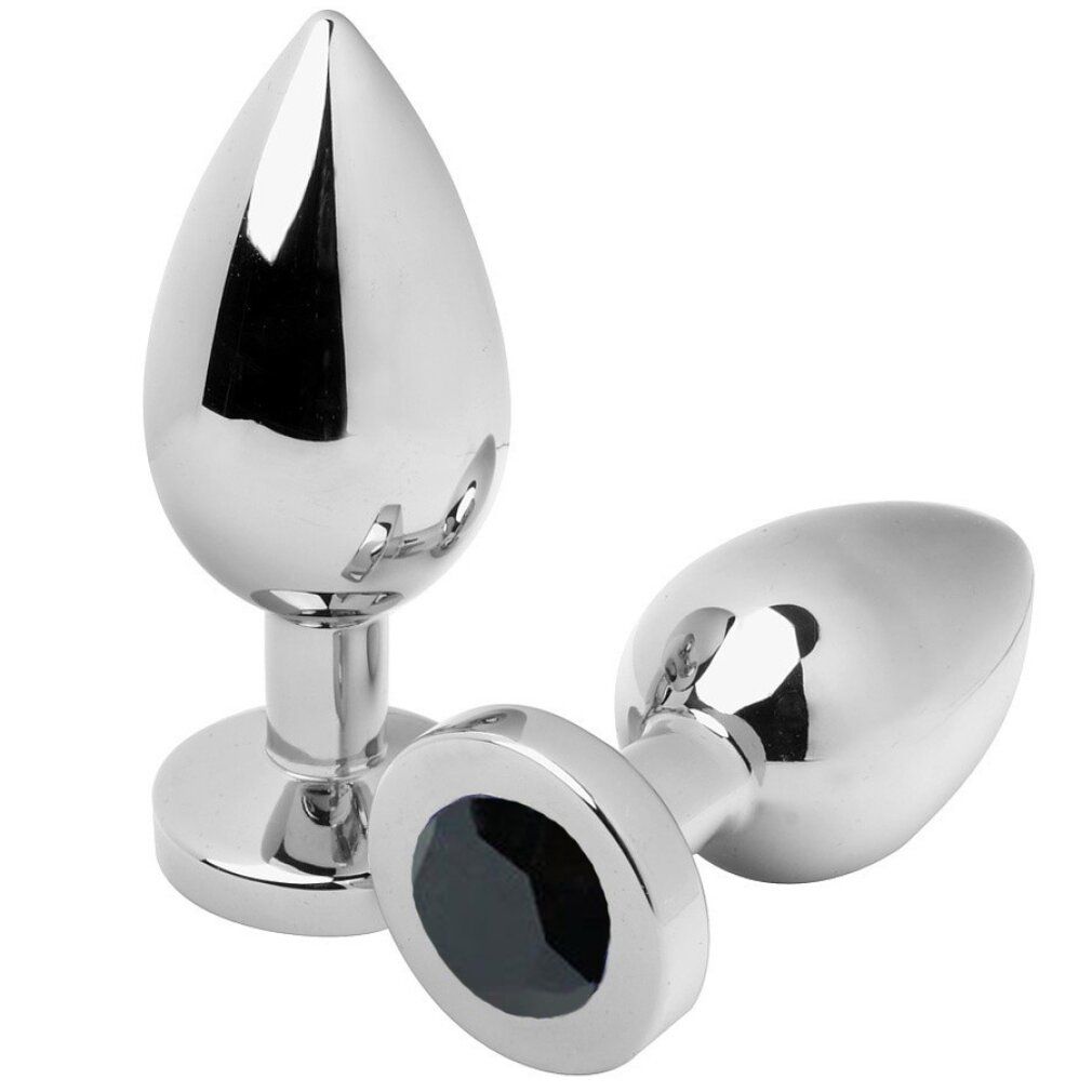 Zwei metallische Analstecker. Tropfenförmiger Kopf, schwarzer Stein am Sockel. Glänzende Oberfläche.