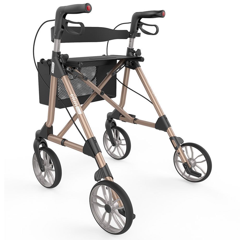 Rollator in Champagnerfarbe. Schwarzer Sitz, Korb und Handgriffe. Vier Räder mit silbernen Felgen.