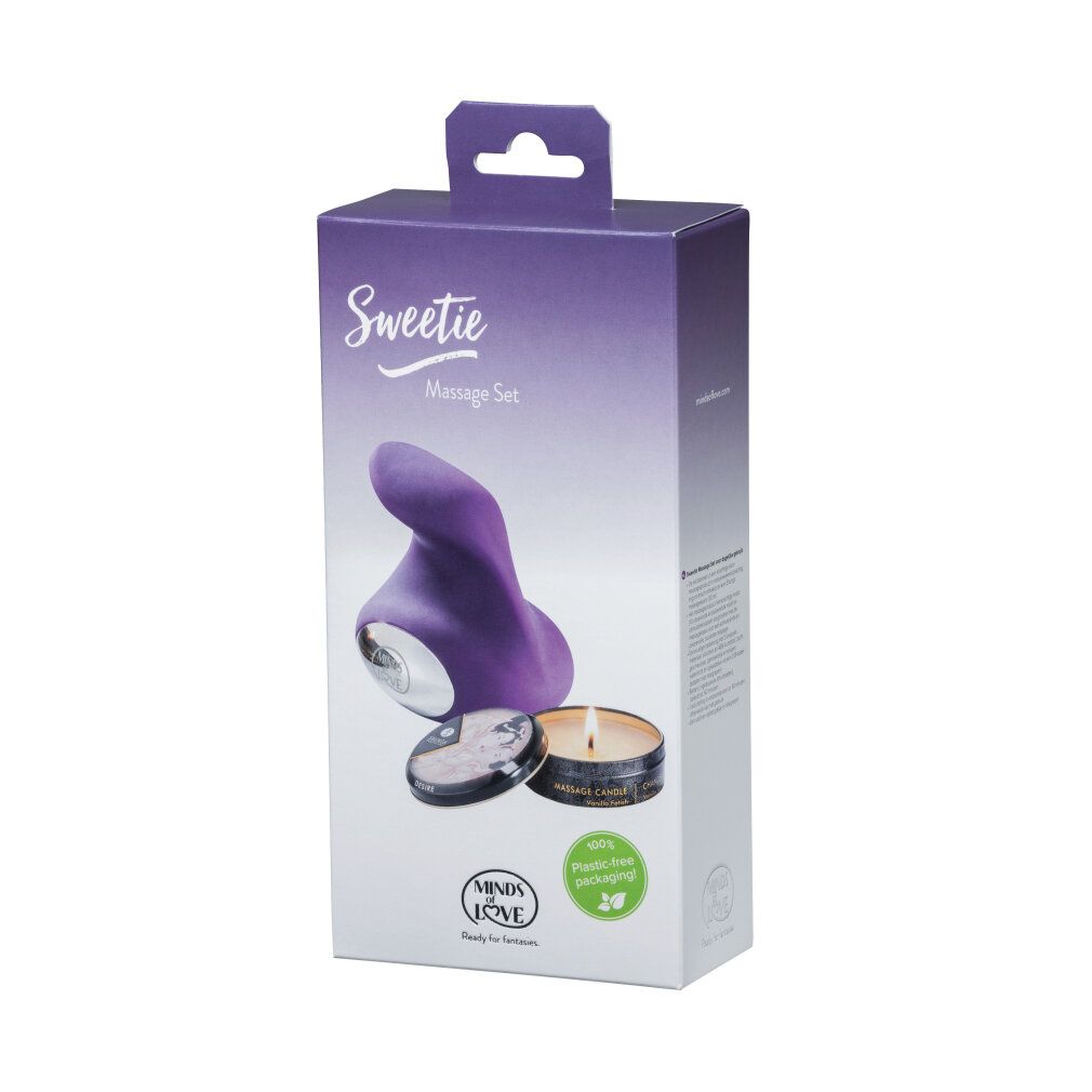 Produktverpackung mit lila Massagegerät und Kerze. Text: "Sweetie Massage Set" und "MINDS of LOVE".