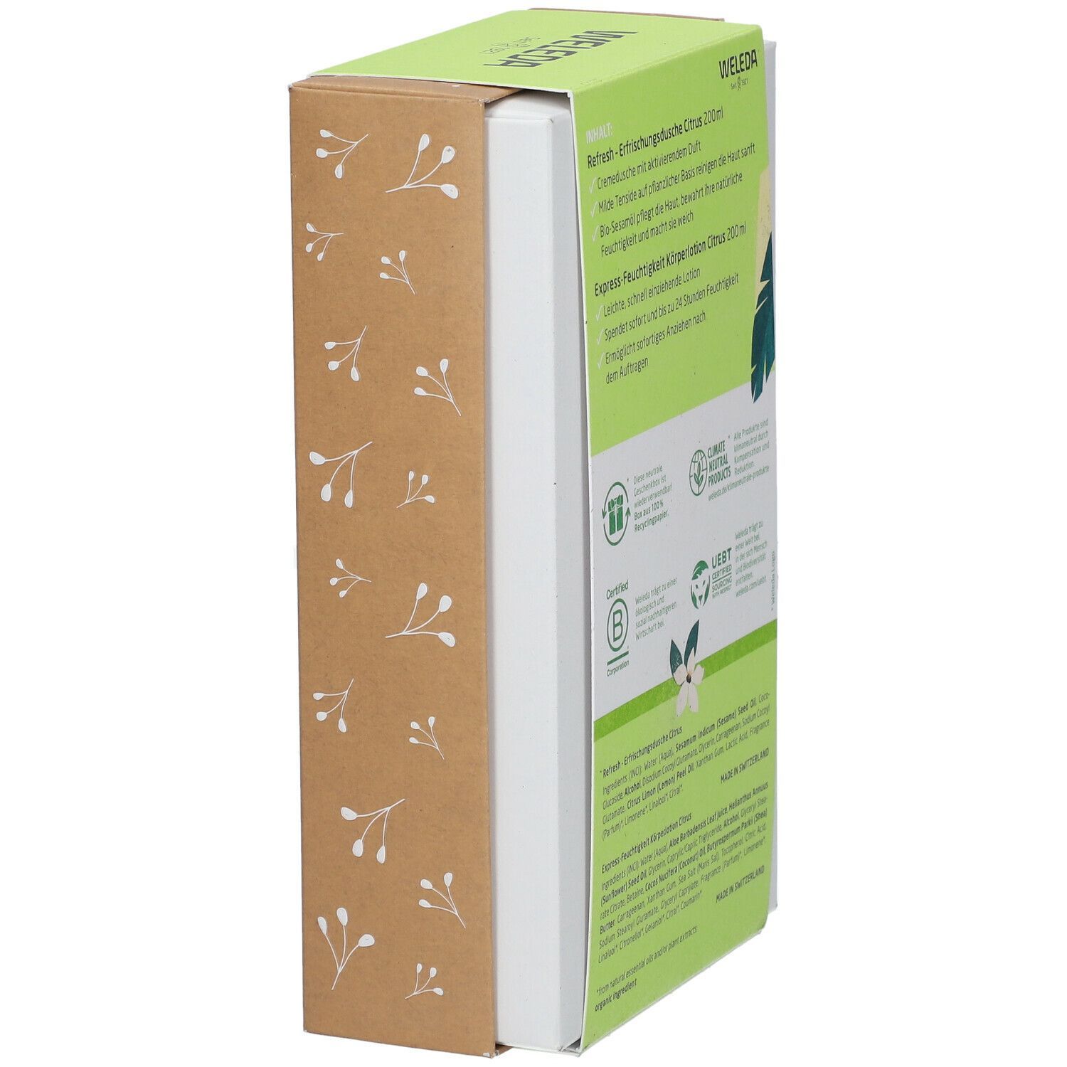 Geschenkset, seitlich. Grüne Verpackung mit Text: Weleda, Refresh, Express-Feuchtigkeit. Braune Kartonage mit weißen Blüten.