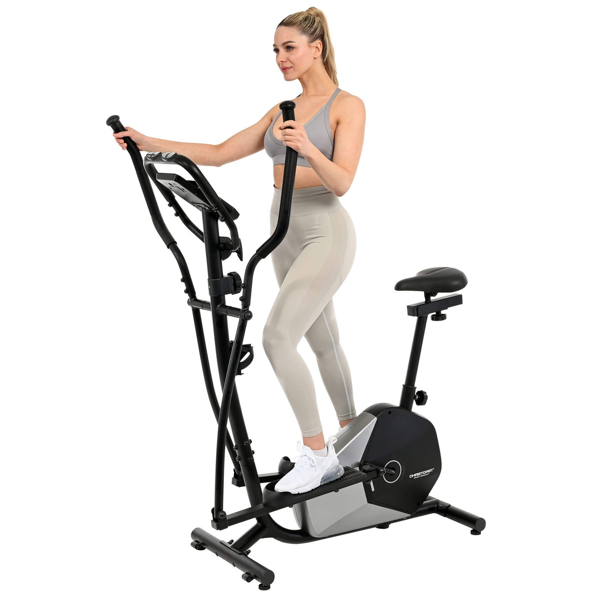 Crosstrainer CT 6 Hybrid 2in1. Schwarzes und silbernes Fitnessgerät. Frau trainiert. Pedale, Griffe und Sitz sichtbar.