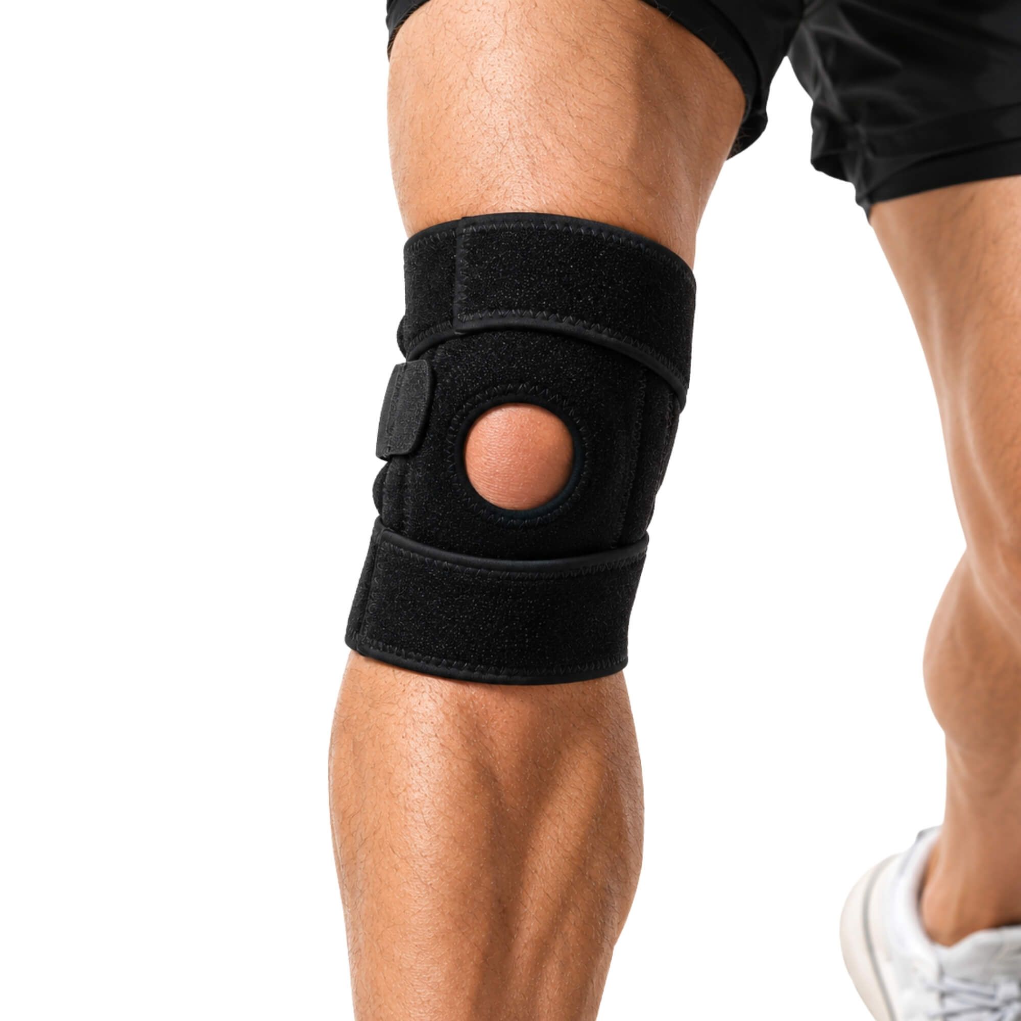 Schwarze Kniebandage mit Patella-Aussparung und Klettverschlüssen zur individuellen Anpassung.