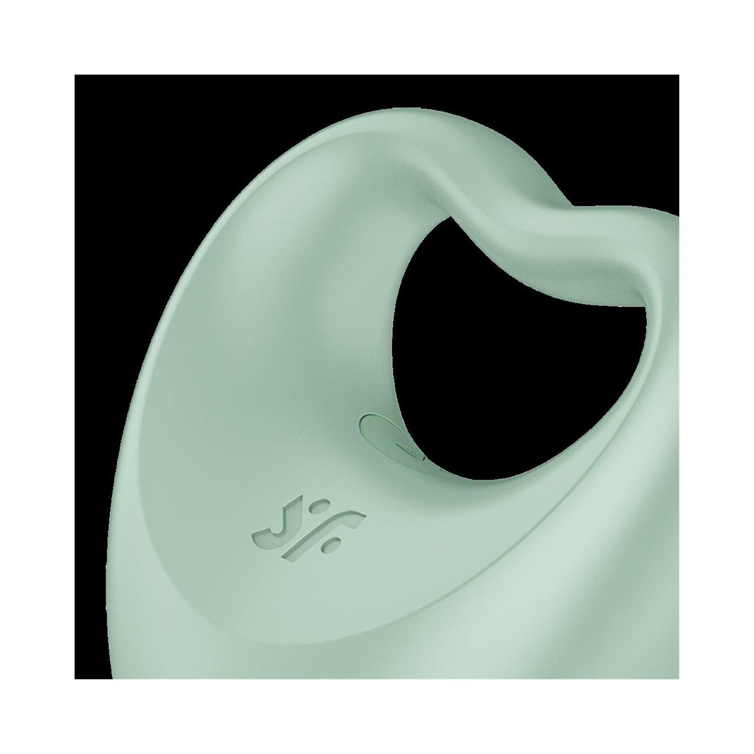 Nahaufnahme des Penisrings mit Fingervibrator. Mintfarben, herzförmig. Logo des Herstellers.