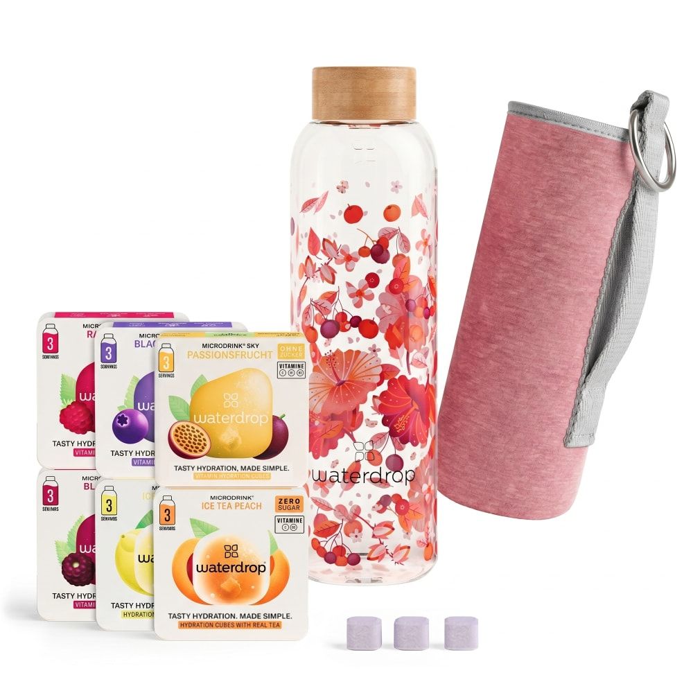 Glasflasche mit Blumenmuster, sechs Geschmackspackungen, Schutzhülle und drei Tabletten.