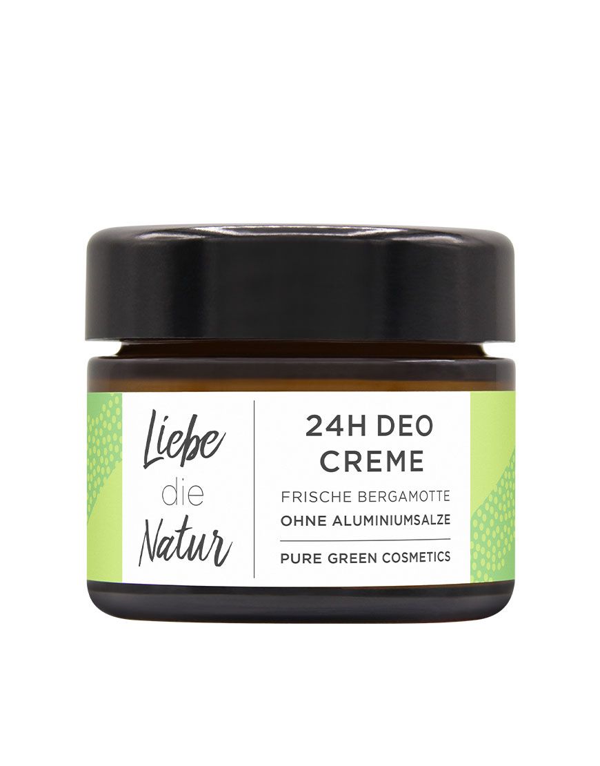 Deocreme-Glas mit schwarzem Deckel. Etikett mit Schriftzug, grünen Akzenten und Produktinformationen. Weißer Hintergrund.