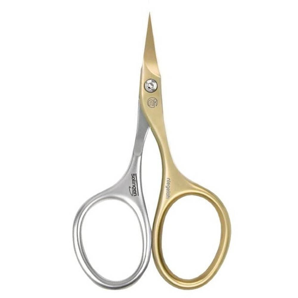 Ciseaux à cuticules Niegeloh Solingen. Silberfarbene Griffe, goldfarbene Klingen. Aufschrift Solingen und Niegeloh.