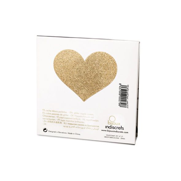 Rückseite einer weißen Verpackung mit einem goldfarbenen, herzförmigen Nippelcover. Aufdruck: Bijoux Indiscrets.