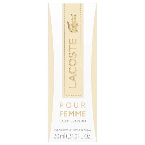 Lacoste Pour Femme Eau de Parfum-Verpackung. Weiß mit beigem Streifen. Logo und Produktname in Gold.