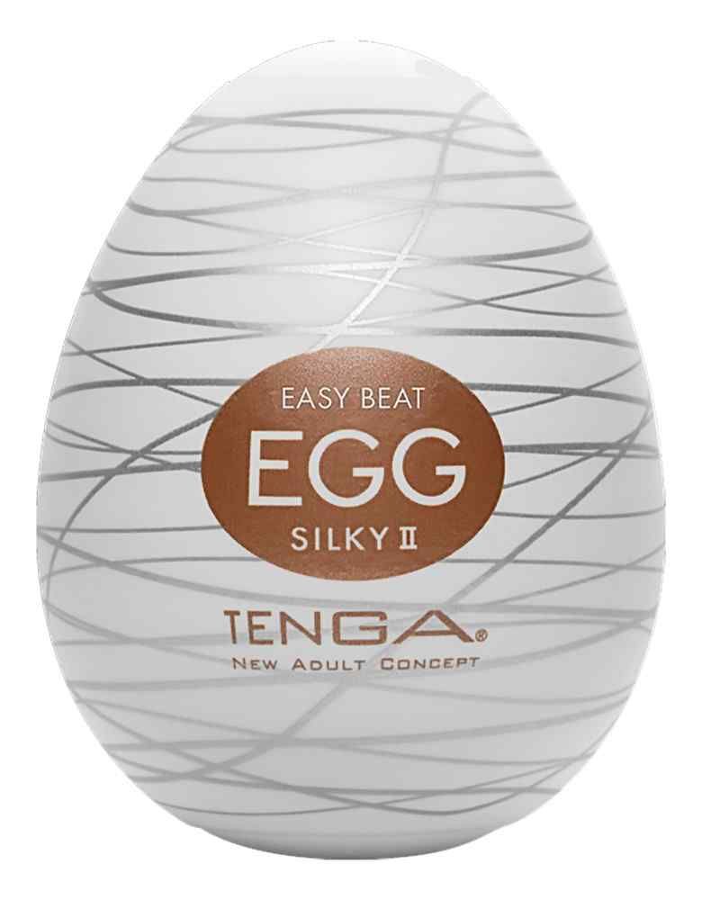Weißes Ei mit silbernen Linien und braunem Aufkleber mit der Aufschrift "EGG Silky II". Marke: TENGA.