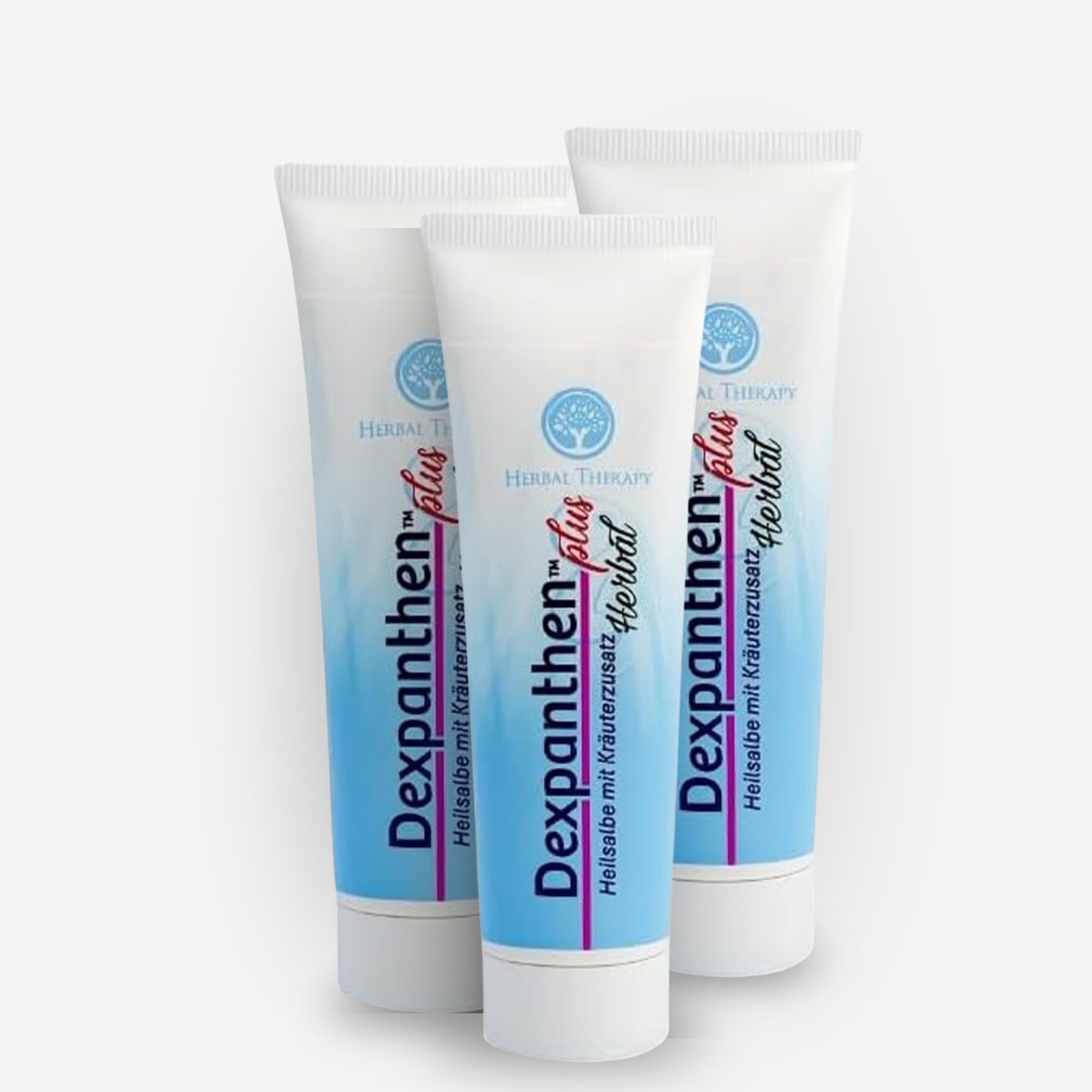 Drei weiße Tuben Dexpanthenol Plus Herbal Salbe mit Kräuterzusatz.