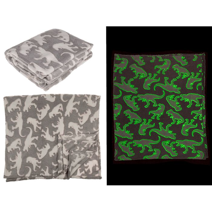 Drei Kuscheldecken: gefaltet, ausgebreitet, und leuchtend grün. Dinosaurier-Muster auf grau und dunkel.
