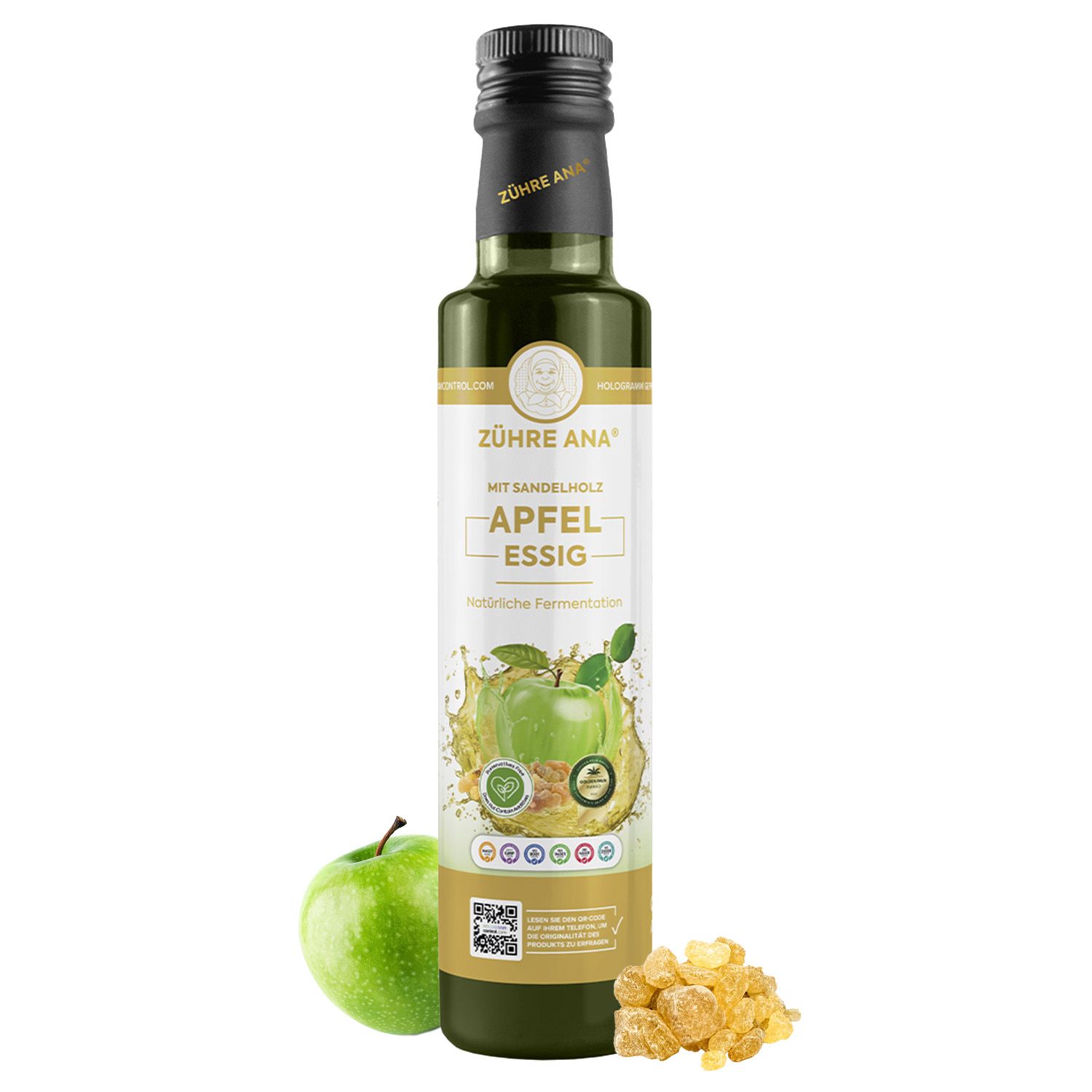 Flasche Apfelessig mit Sandelholz, mit einem grünen Apfel und Bernsteinstückchen daneben.