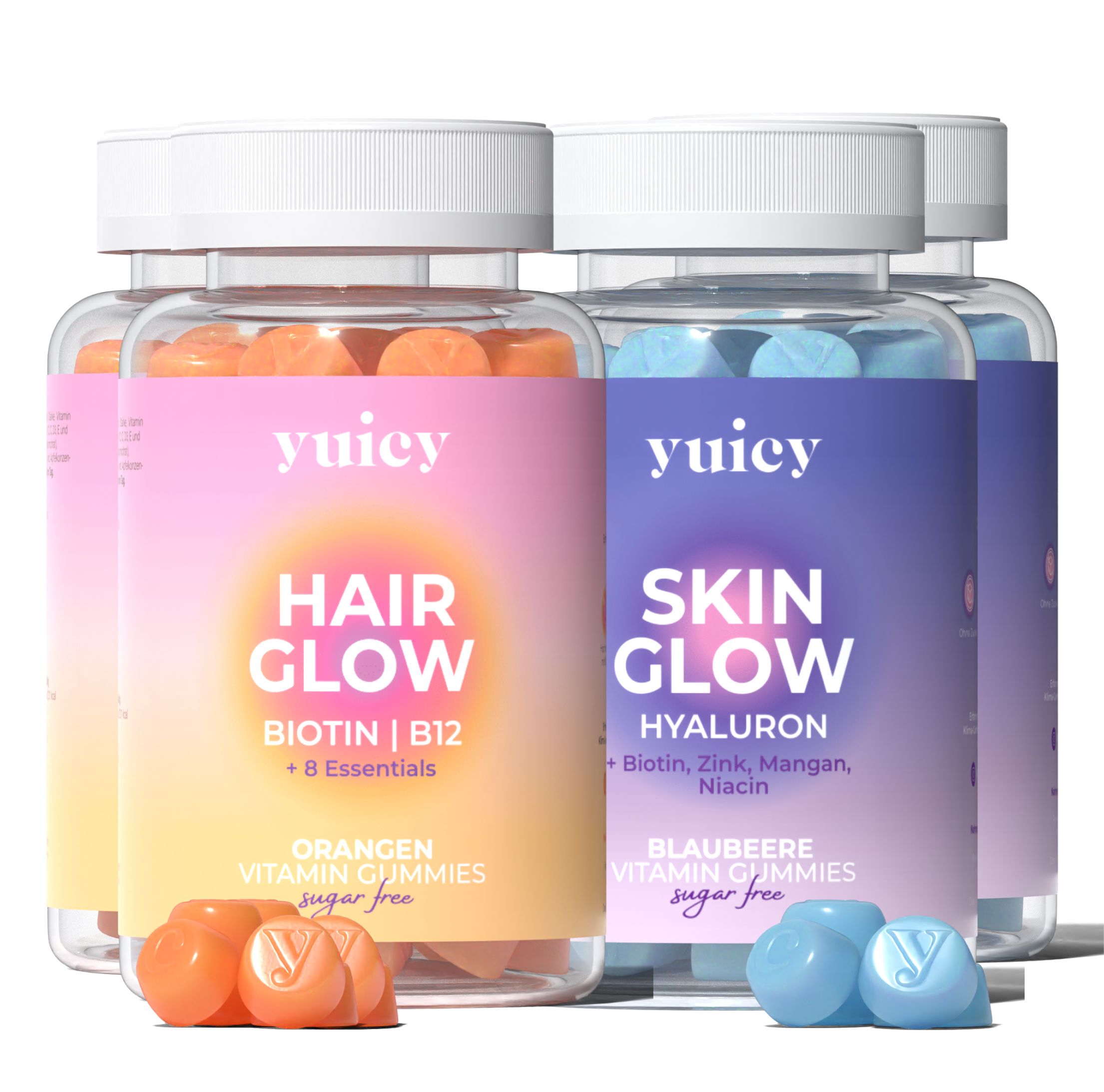 Mehrere Flaschen Hair & Skin Vitamin Gummies Duo. Zwei Flaschen mit orangefarbenen und blauen Gummibärchen. Aufschrift: yuicy.