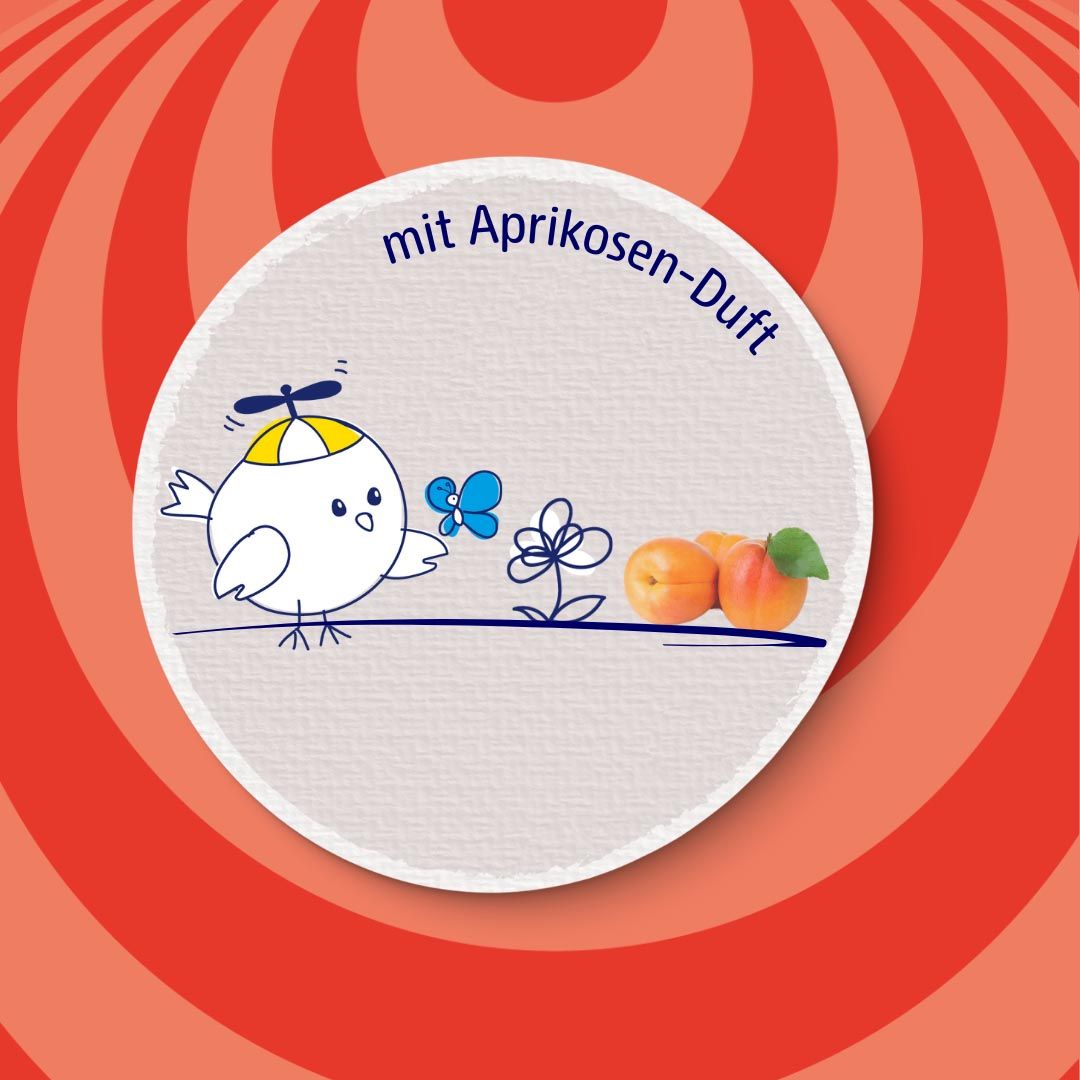 Rundes Etikett mit Cartoon-Figur, Text: mit Aprikosen-Duft und Abbildung von Aprikosen.