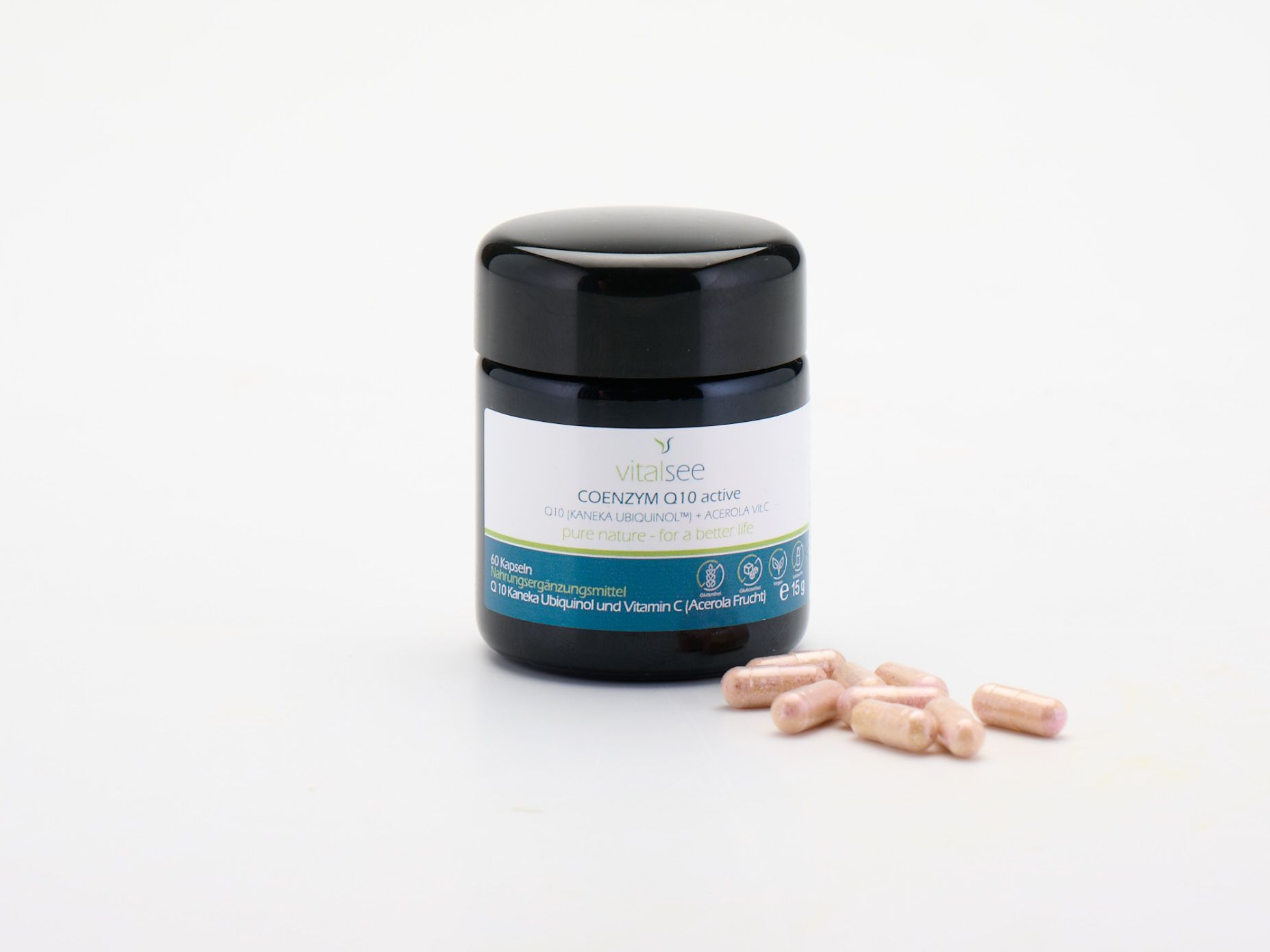 Schwarze Dose mit Kapseln daneben. Aufschrift: COENZYM Q10 active, KANEKA UBIQUINOL + Vitamin C. 60 Kapseln.