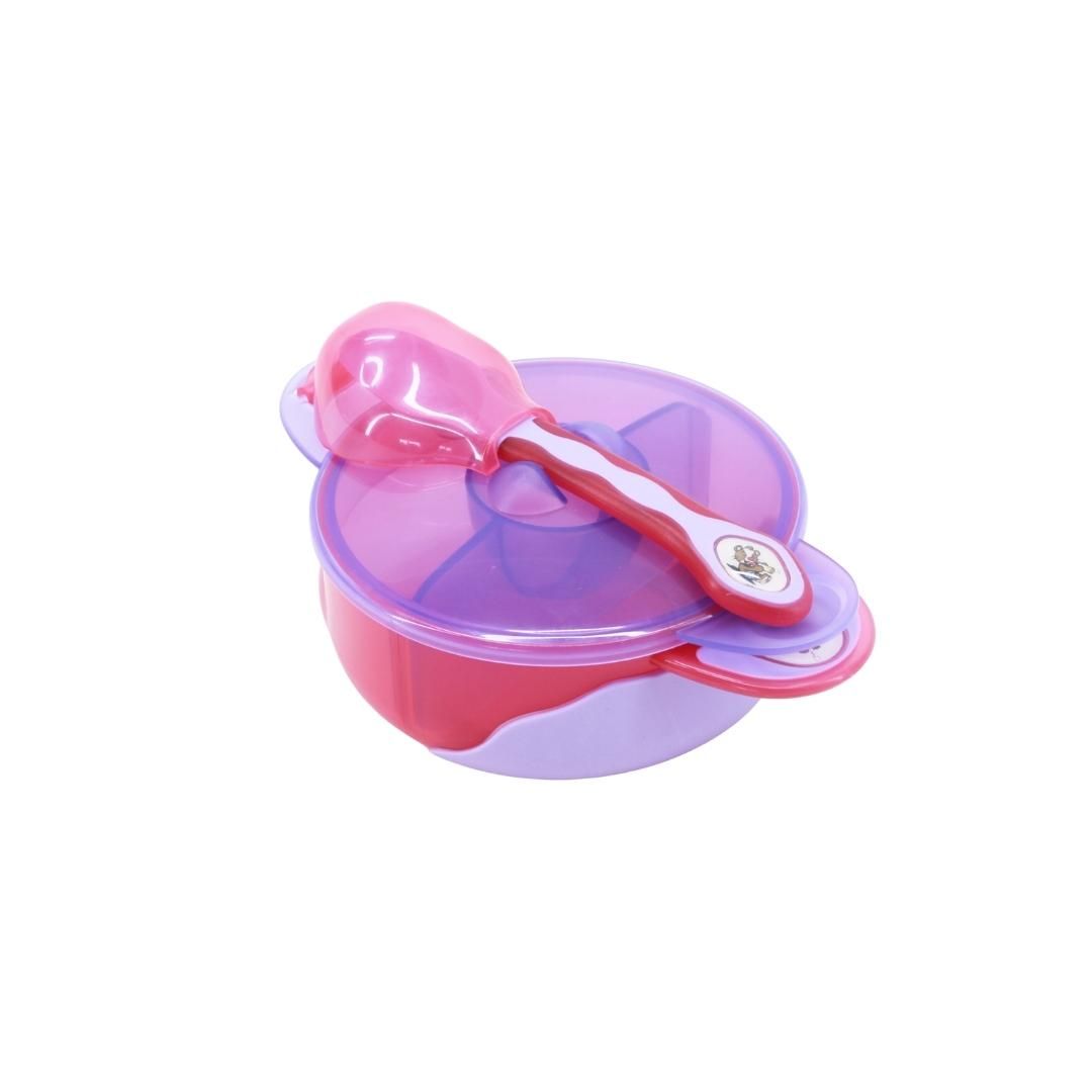 Rosa Babynahrungsschüssel mit Deckel und Löffel. Die Schüssel hat zwei Fächer. Der Löffel liegt auf dem Deckel.