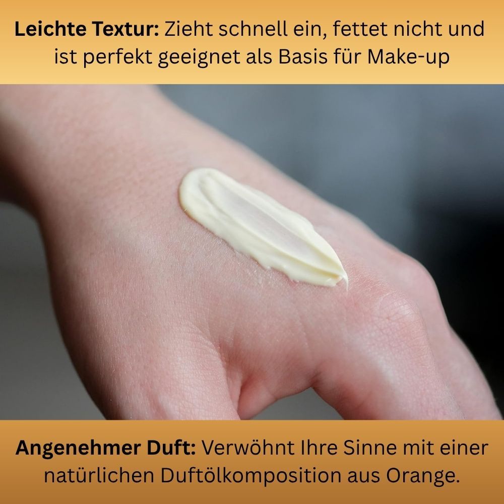 Creme auf Hand. Text: Leichte Textur: Zieht schnell ein, fettet nicht. Angenehmer Duft: natürliche Duftölkomposition aus Orange.